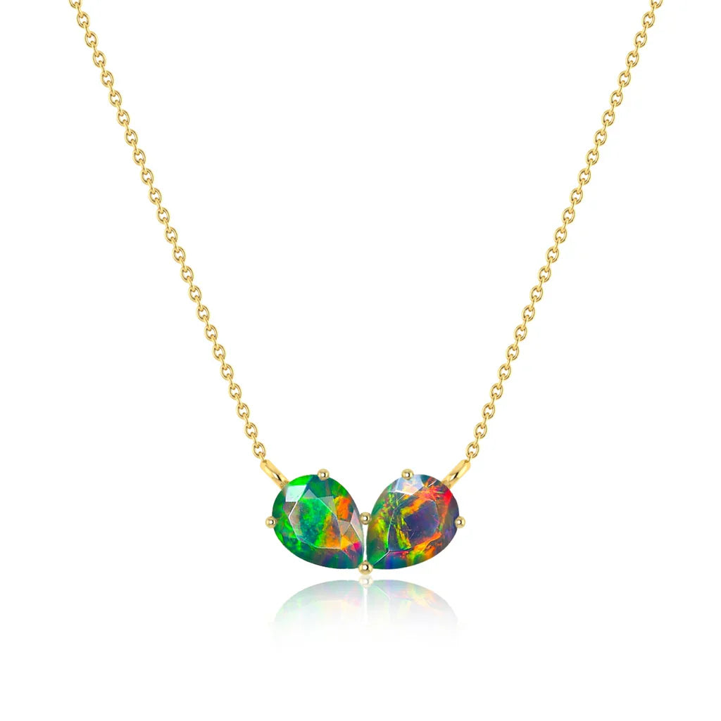 Gold opal pendant necklace with heart-shaped black opal gemstones displaying vibrant rainbow fire