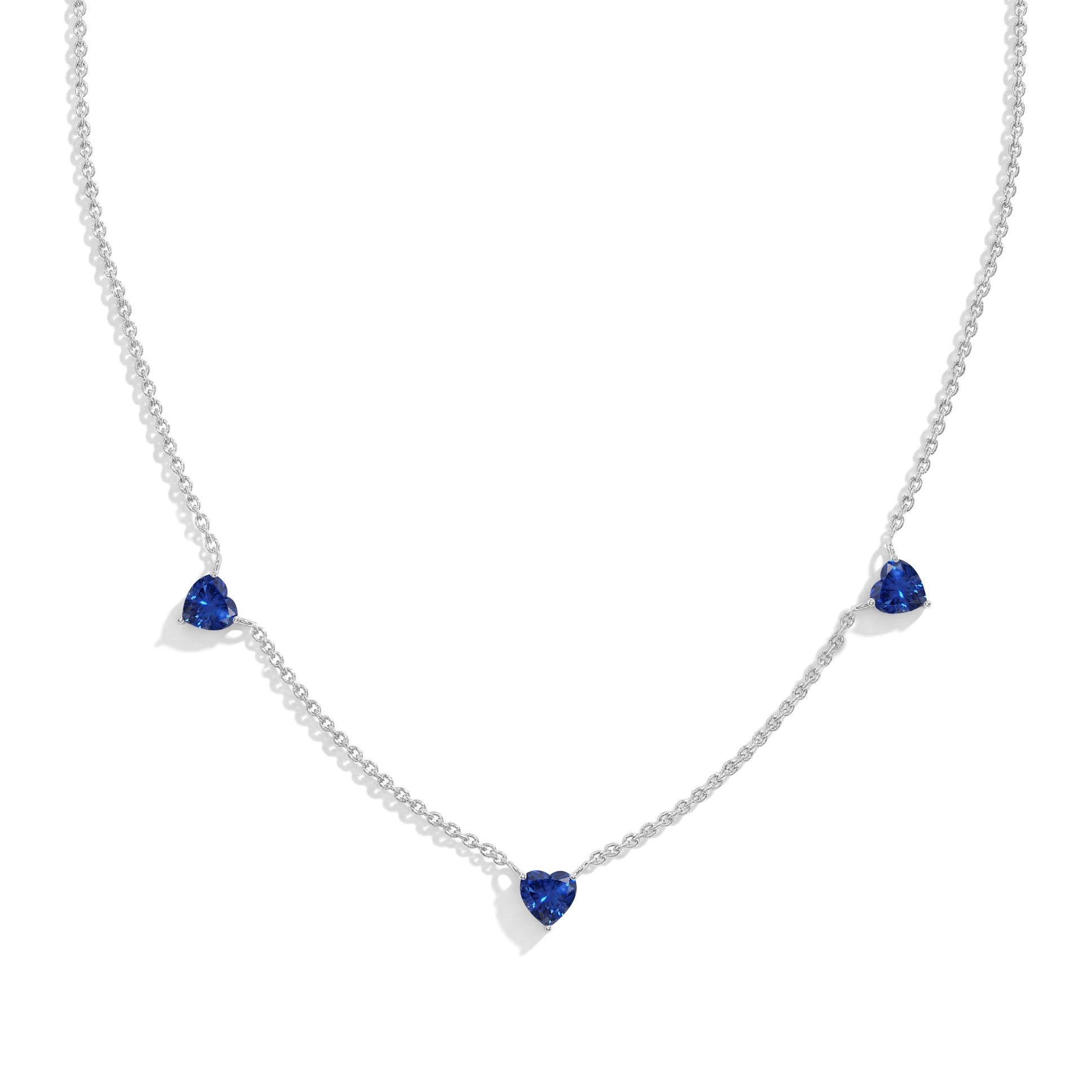"AAA Grade Blue Sapphire Three Stone Heart Necklace in 925 Sterling Silver with genuine heart-cut gemstones.