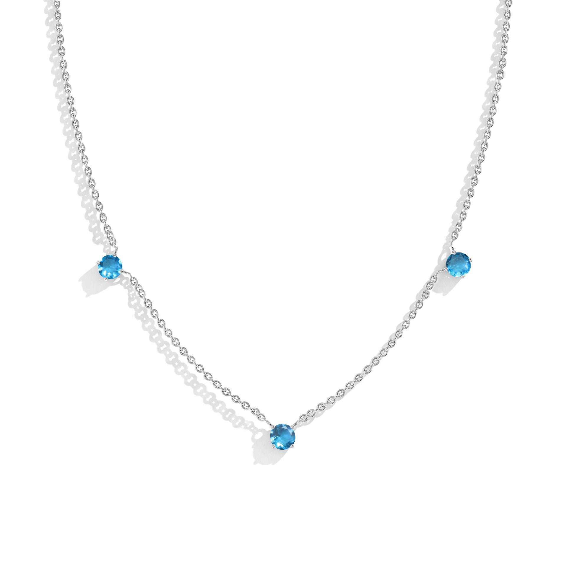 "Elegant Blue Topaz necklace featuring three round gemstones set in a 925 Sterling Silver chain.