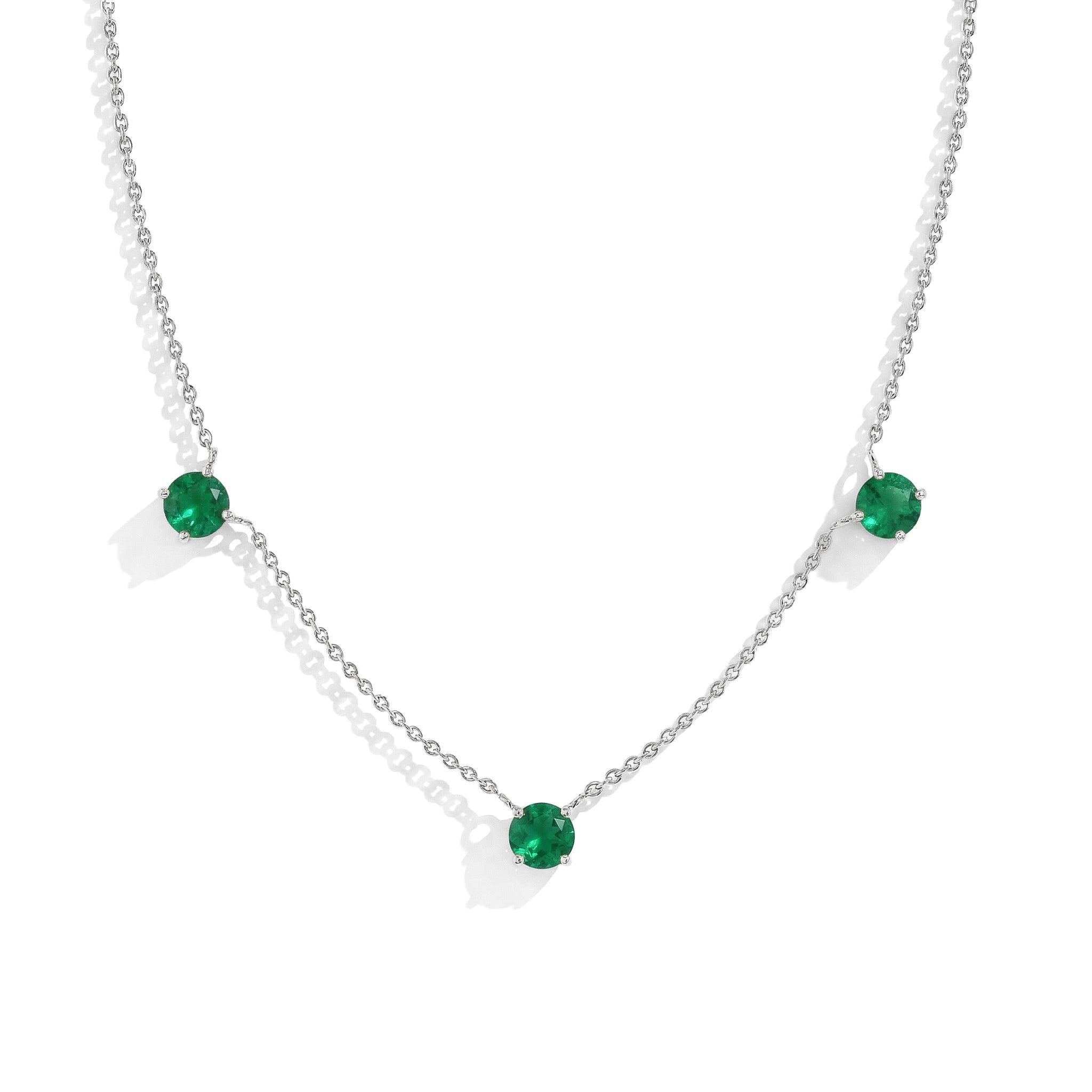 "Dainty Emerald necklace featuring three 5MM round gemstones in 925 Sterling Silver.