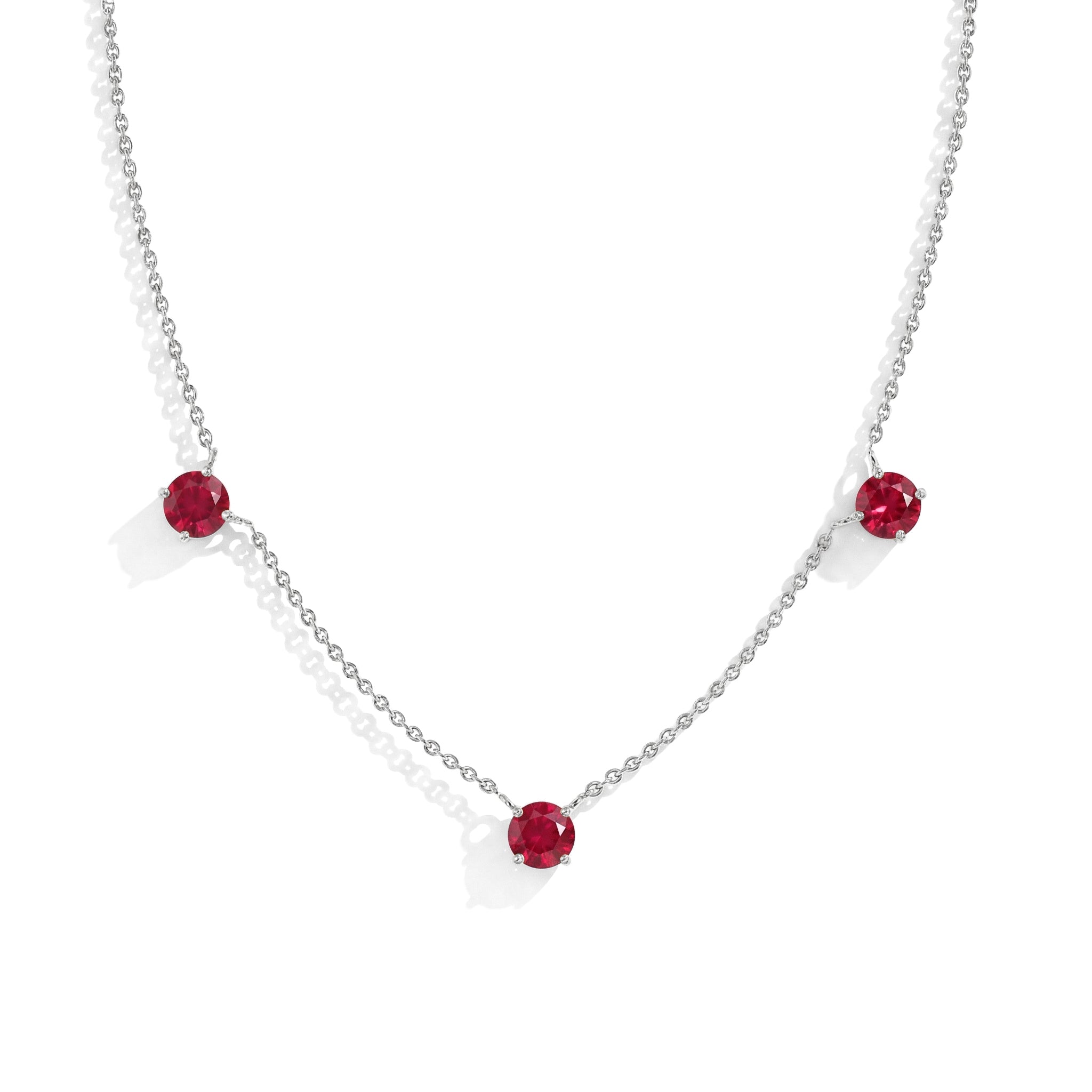 "Dainty Ruby necklace featuring three 5MM round gemstones in 925 Sterling Silver.