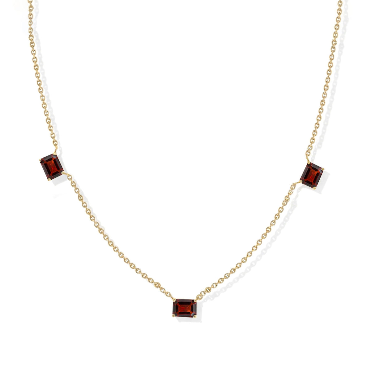 Three stone Garnet necklace featuring rich deep red gemstones.