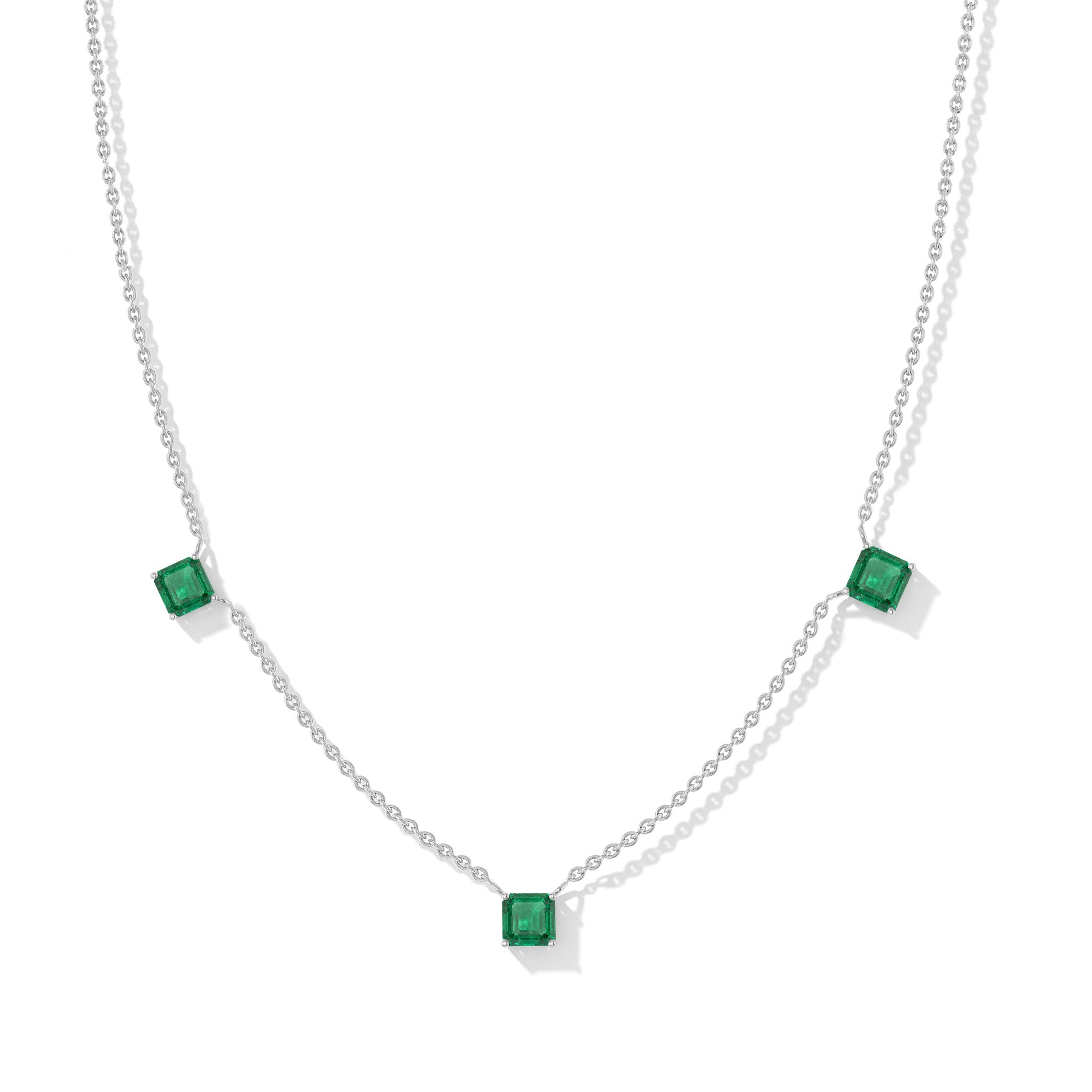 "Elegant Emerald Asscher cut necklace with three green gemstones in sterling silver.