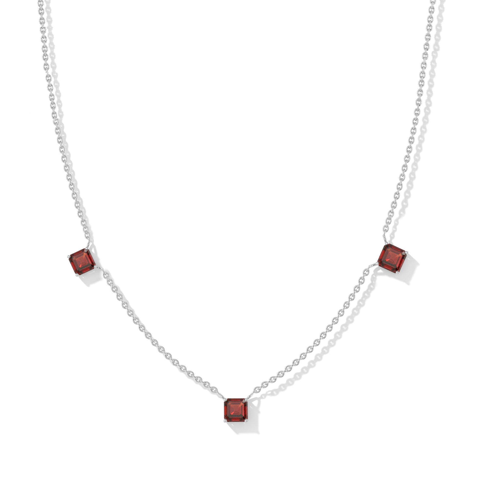 "Elegant Garnet Asscher cut necklace with three deep red gemstones in sterling silver.