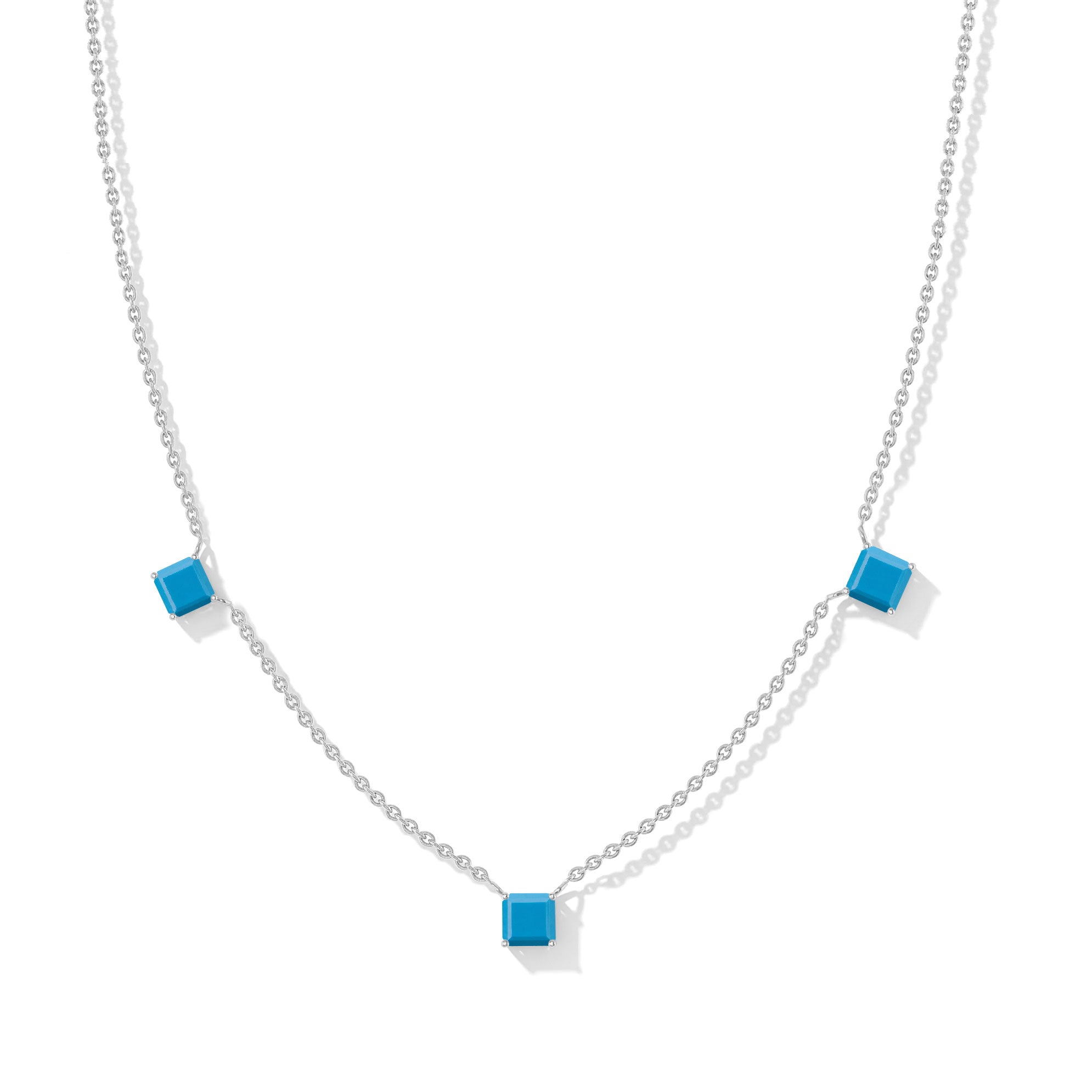 "Turquoise Asscher cut station necklace in yellow gold filled and 925 sterling silver featuring three blue gemstones.