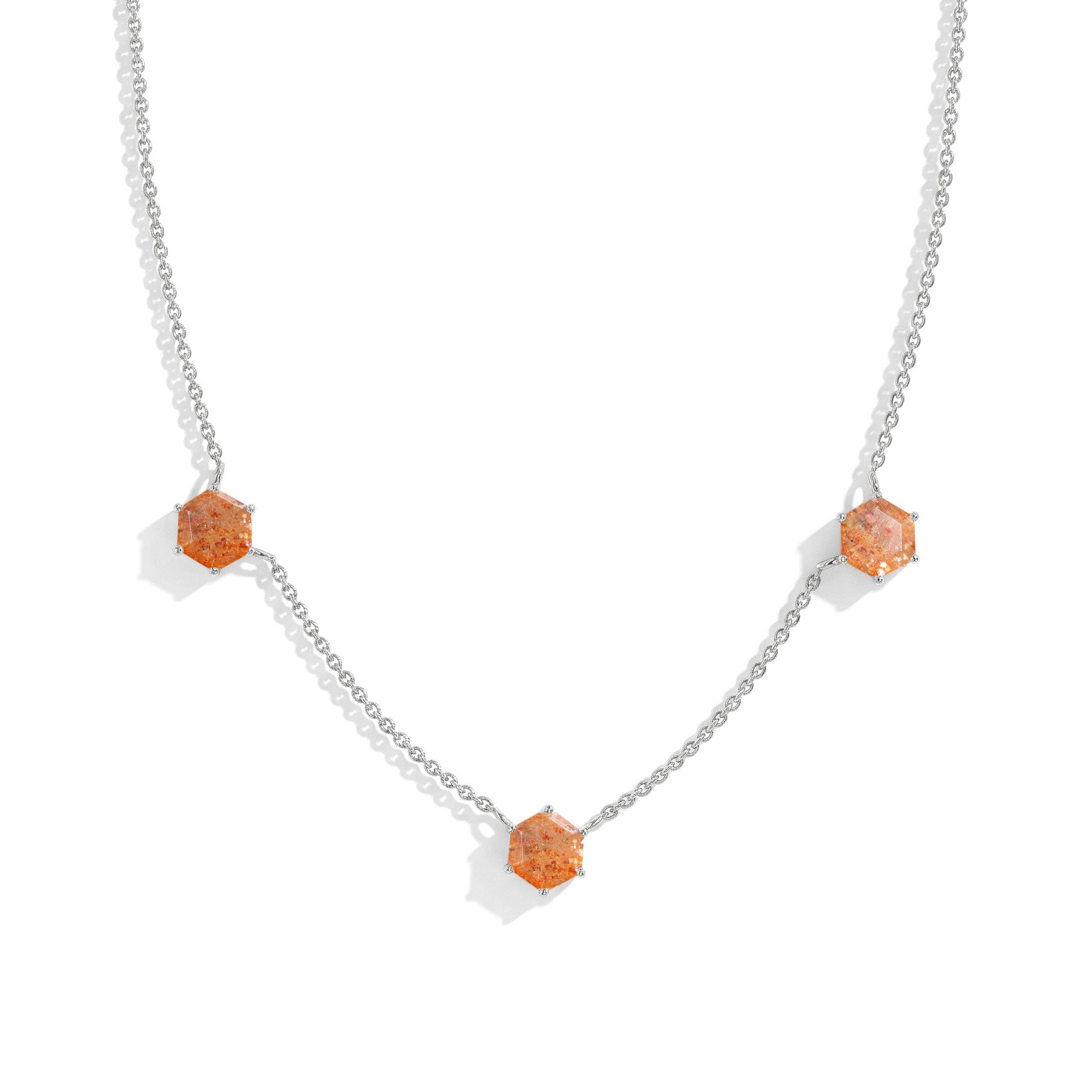 "Three stone sunstone station necklace featuring hexagon cut gemstones
