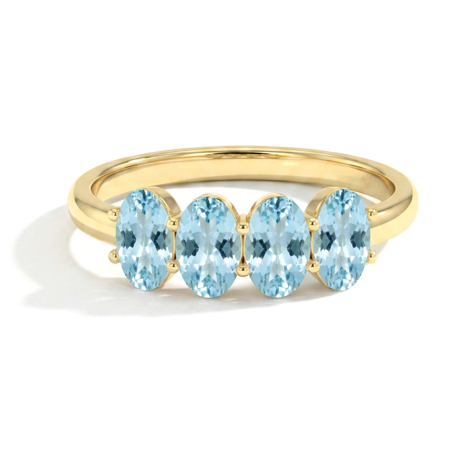 yellow gold filled aquamarine ring, blue crystal ring, four oval gemstones, luxury gemstone jewelry, delicate band ring, women's fashion ring, anniversary gift, modern jewelry, elegant gold ring, handcrafted jewelry, fine ring, statement band