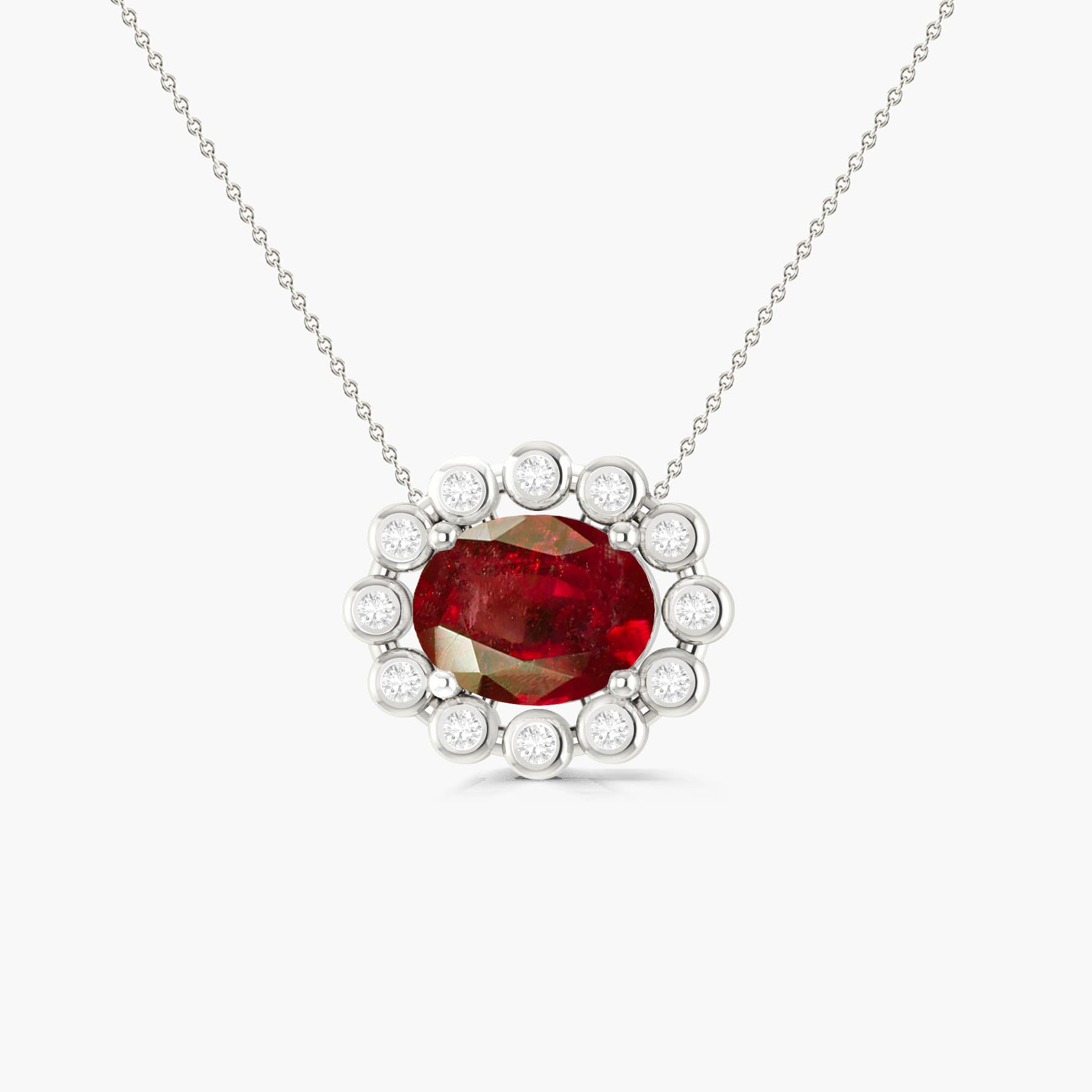 Bezel - Set Zircons Framing an Oval Ruby Pendant - Goodstone Jewels