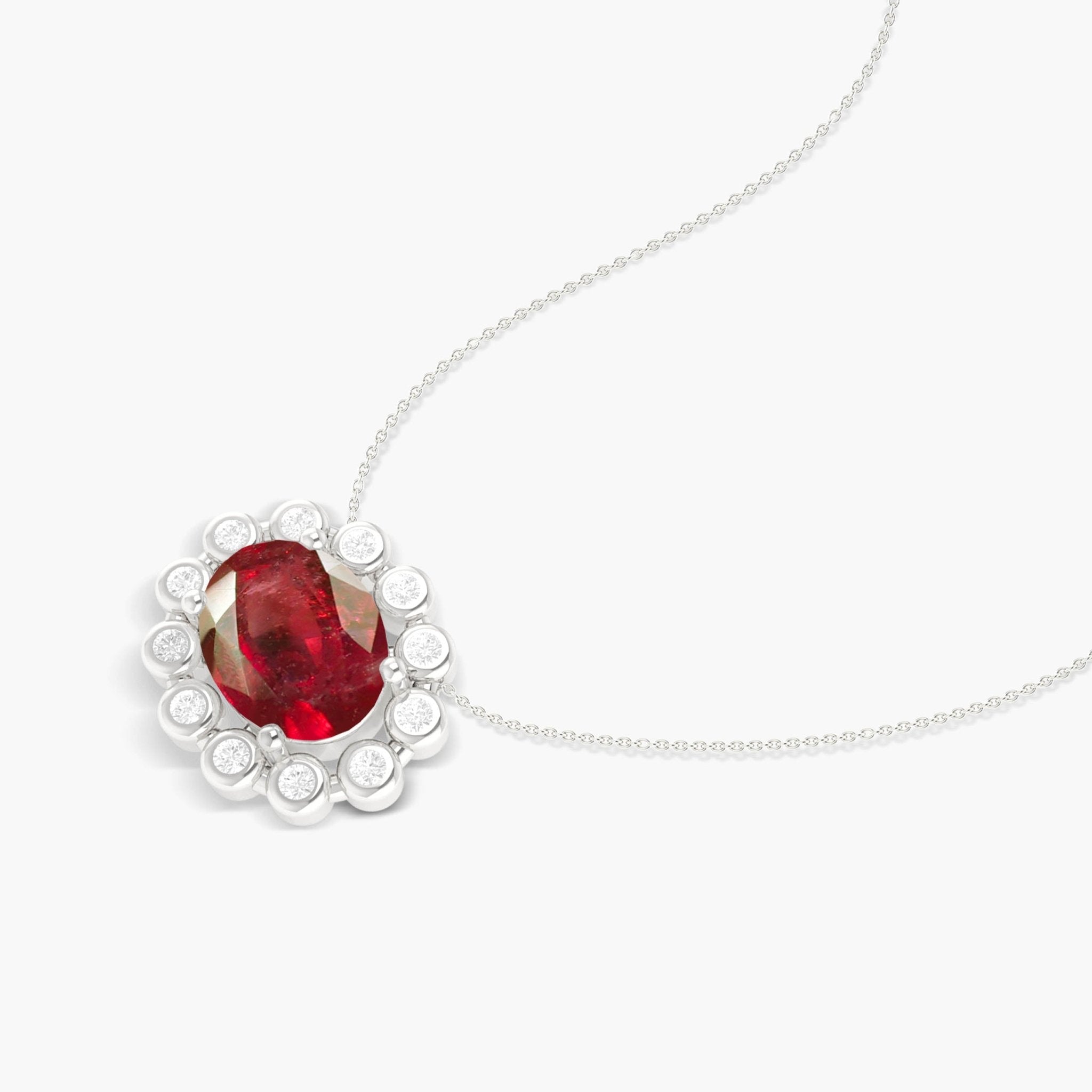 Bezel - Set Zircons Framing an Oval Ruby Pendant - Goodstone Jewels