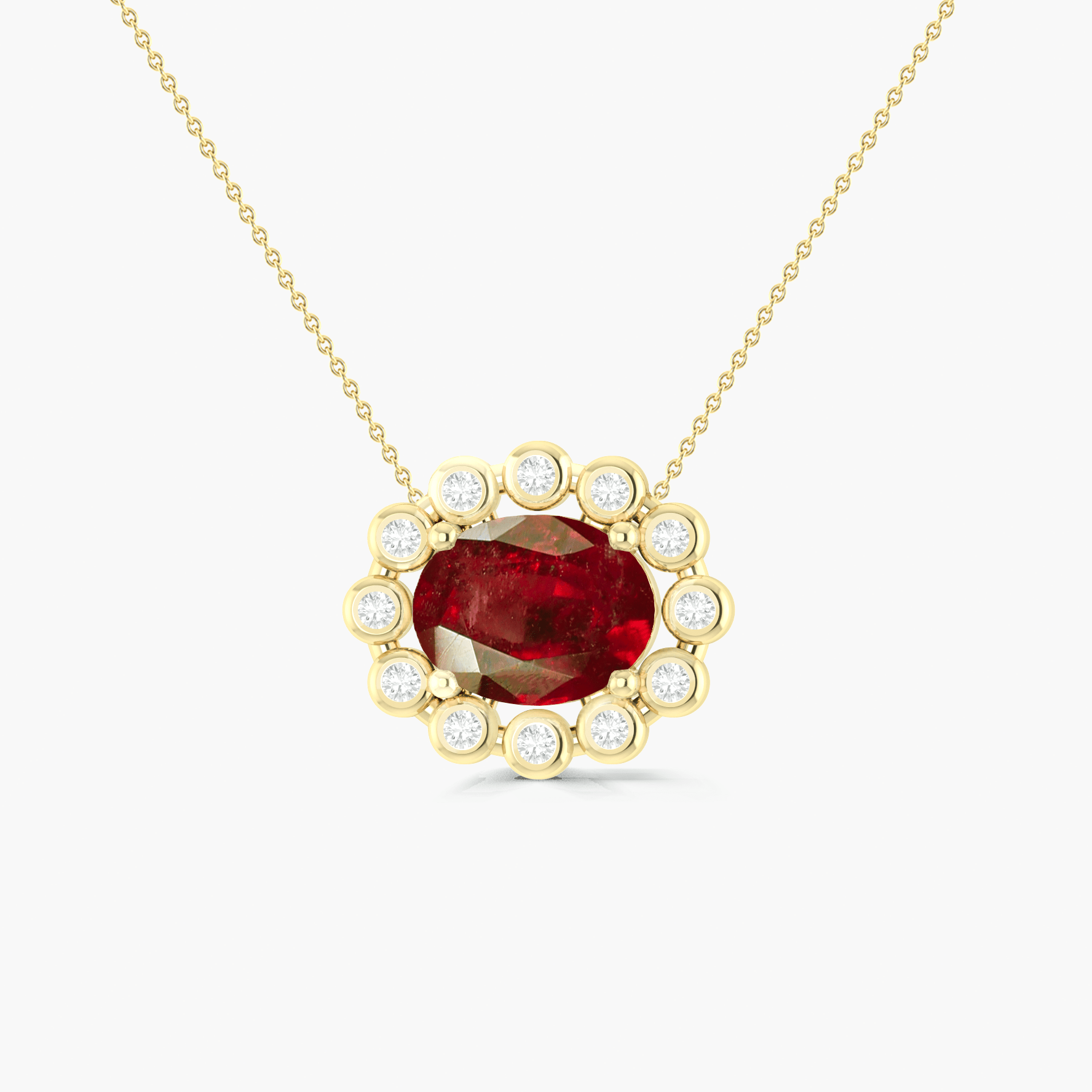 Bezel - Set Zircons Framing an Oval Ruby Pendant - Goodstone Jewels
