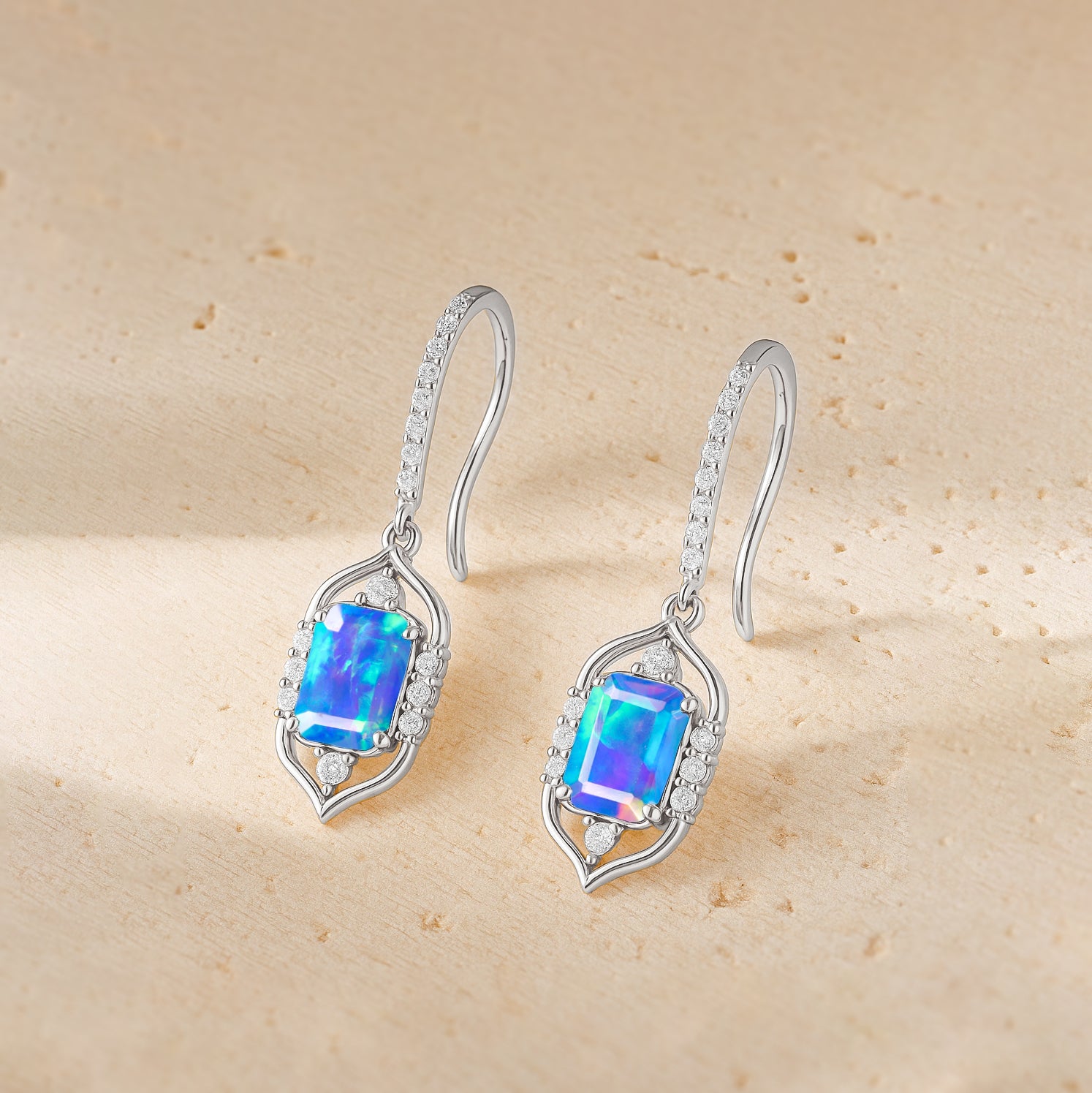 Handmade blue opal earrings with a gold finish. Elegant gemstone jewelry in the USA
