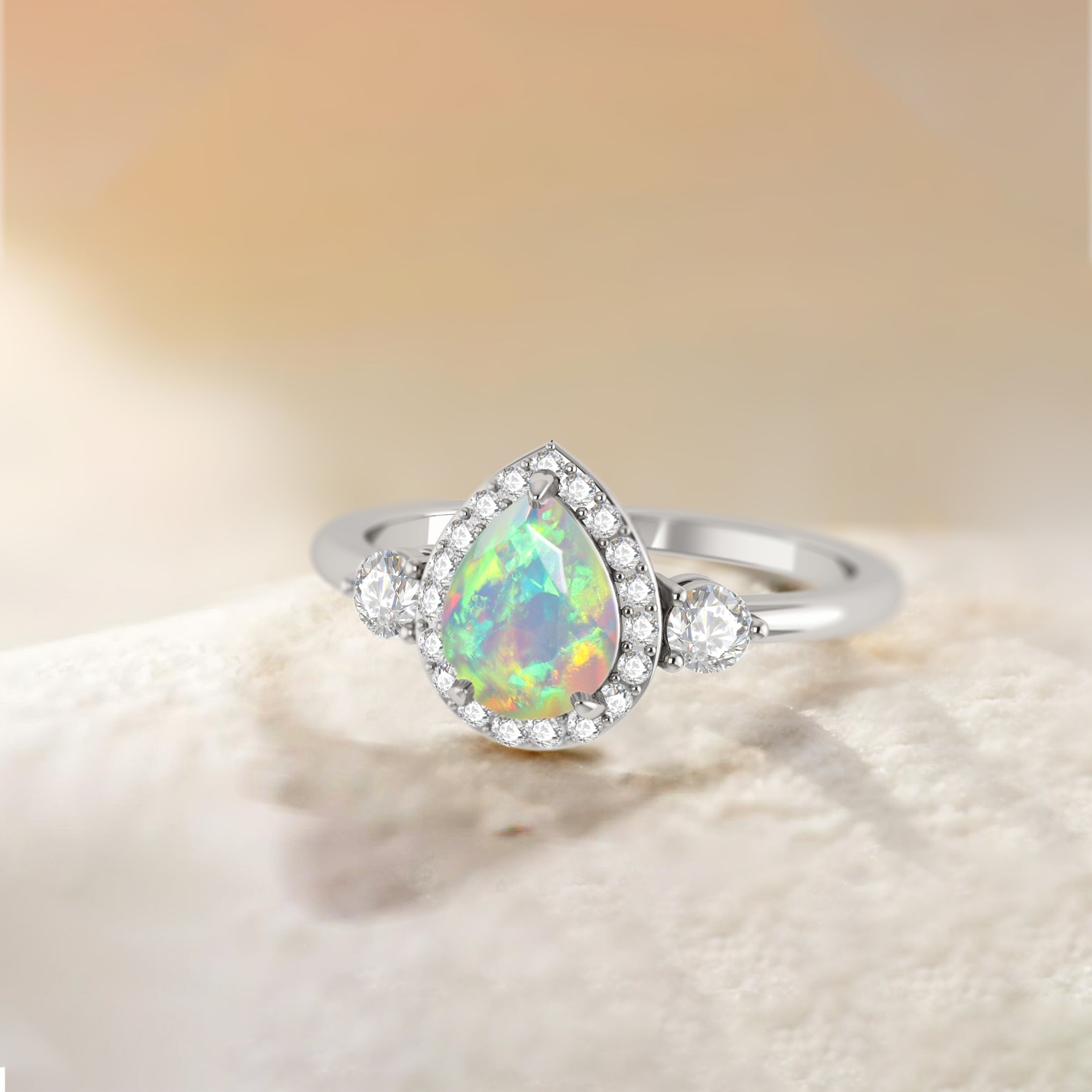 Pear Shape Faceted Natural White Opal Halo Ring - Goodstone Jewels