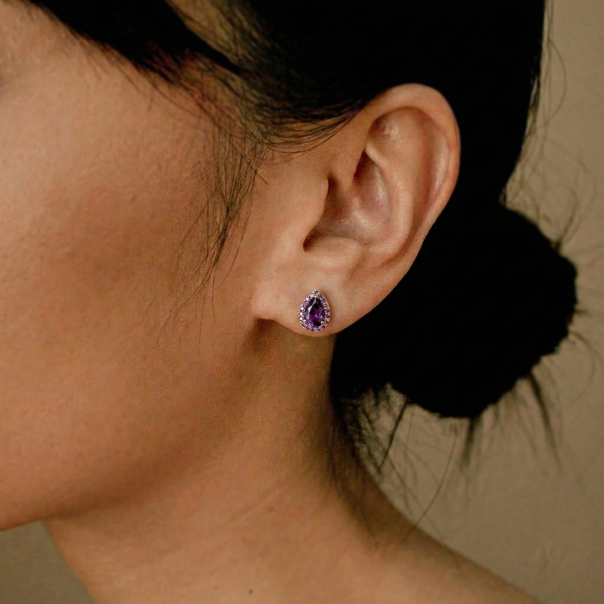 amethyst gemstone earrings for evening wear, artisan amethyst jewelry for women, petite amethyst earrings for daily outfits, amethyst fine jewelry gift idea, sparkling amethyst pear earrings closeup, timeless amethyst gemstone stud earrings

