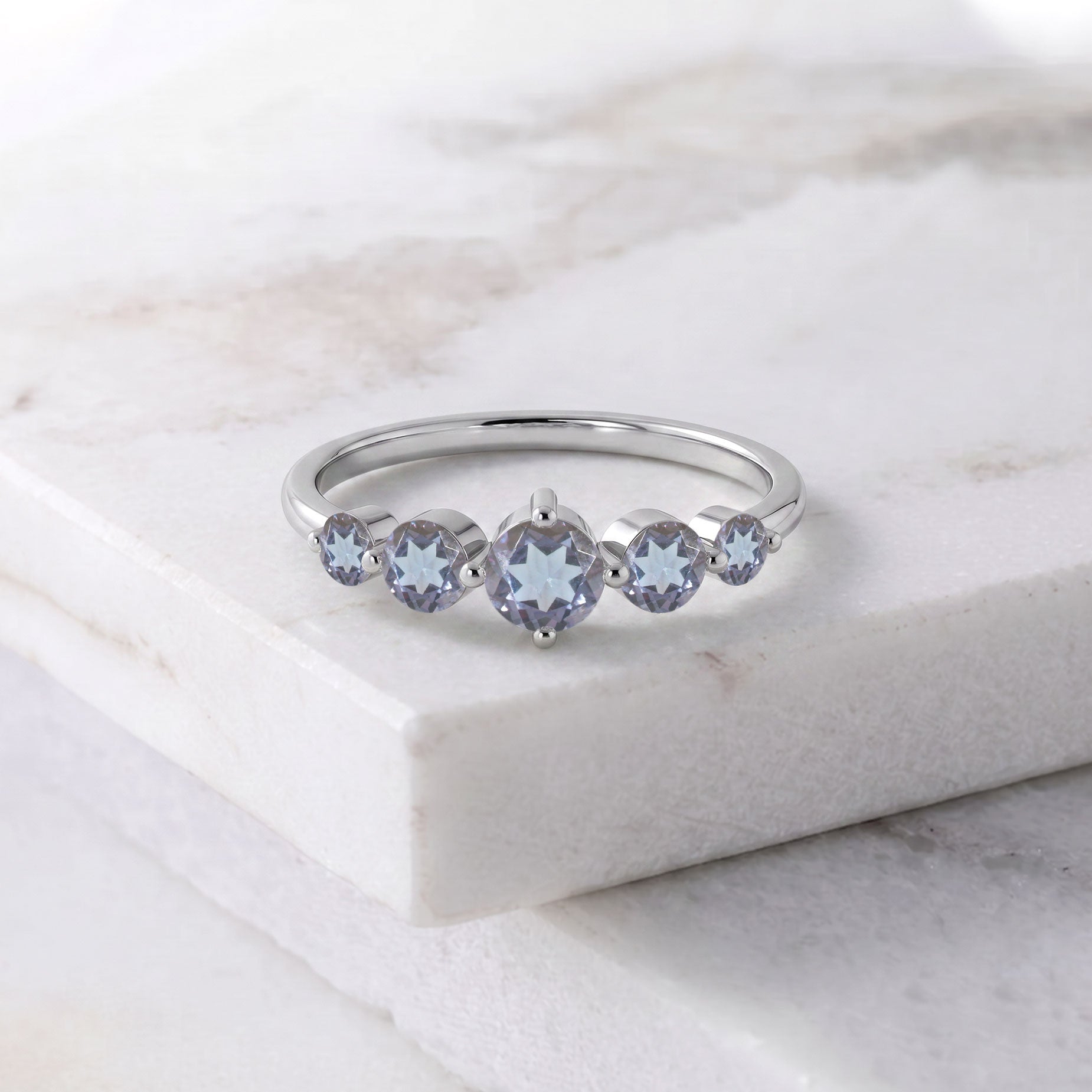 alexandrite fine jewelry, graduated gemstone arrangement, handcrafted sterling silver ring, polished gold filled jewelry, elegant women's fashion, premium gemstone brilliance, sophisticated ring design, anniversary keepsake, artisan crafted accessory, luxury jewelry gift, comfortable everyday ring, timeless collection, colorful gemstone jewelry, statement style, designer ring