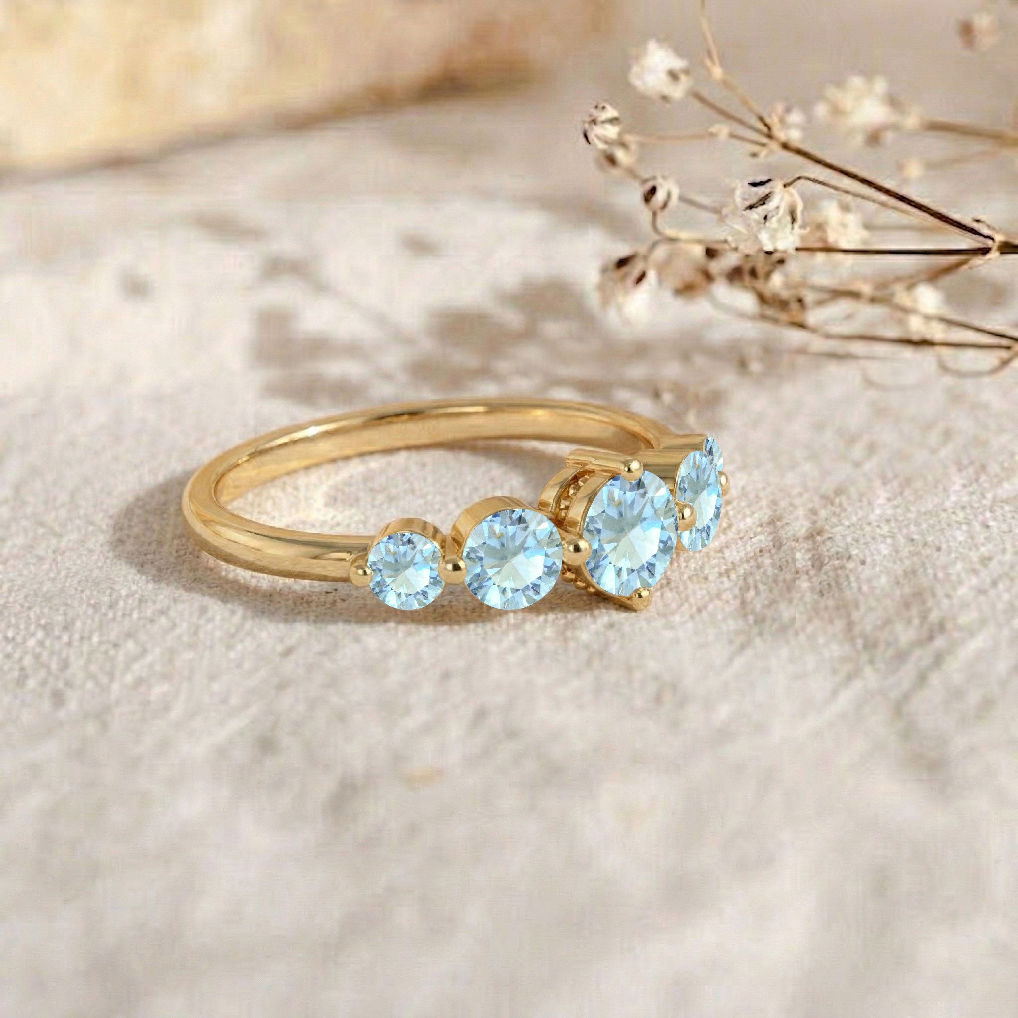 aquamarine anniversary ring, five gemstone arrangement, polished silver jewelry, handcrafted artisan design, gold filled elegant band, luxury blue gemstone ring, classic women's jewelry, premium fine craftsmanship, sparkling round stones, stackable everyday accessory, timeless gift idea, refined fashion jewelry, comfortable wear, elegant gemstone setting, sophisticated ring