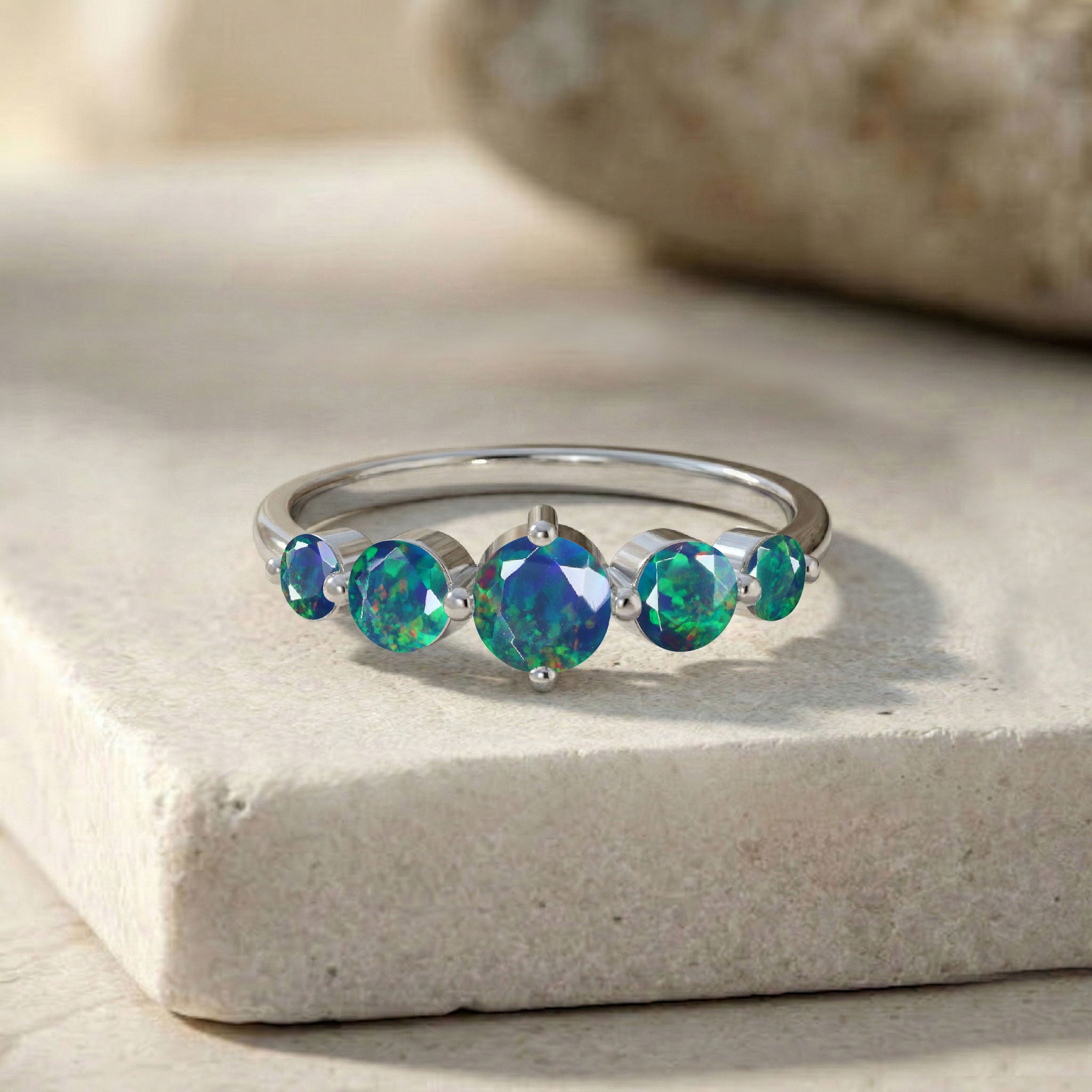natural opal gemstone jewellery, five stone black opal band, sterling silver artisan ring, luxurious gold filled finish, brilliant colour play, handcrafted premium jewellery, elegant women's accessory, October birthstone gift, refined craftsmanship, modern gemstone ring, luxury fashion jewellery, polished band design, timeless style, exclusive ring, premium collection