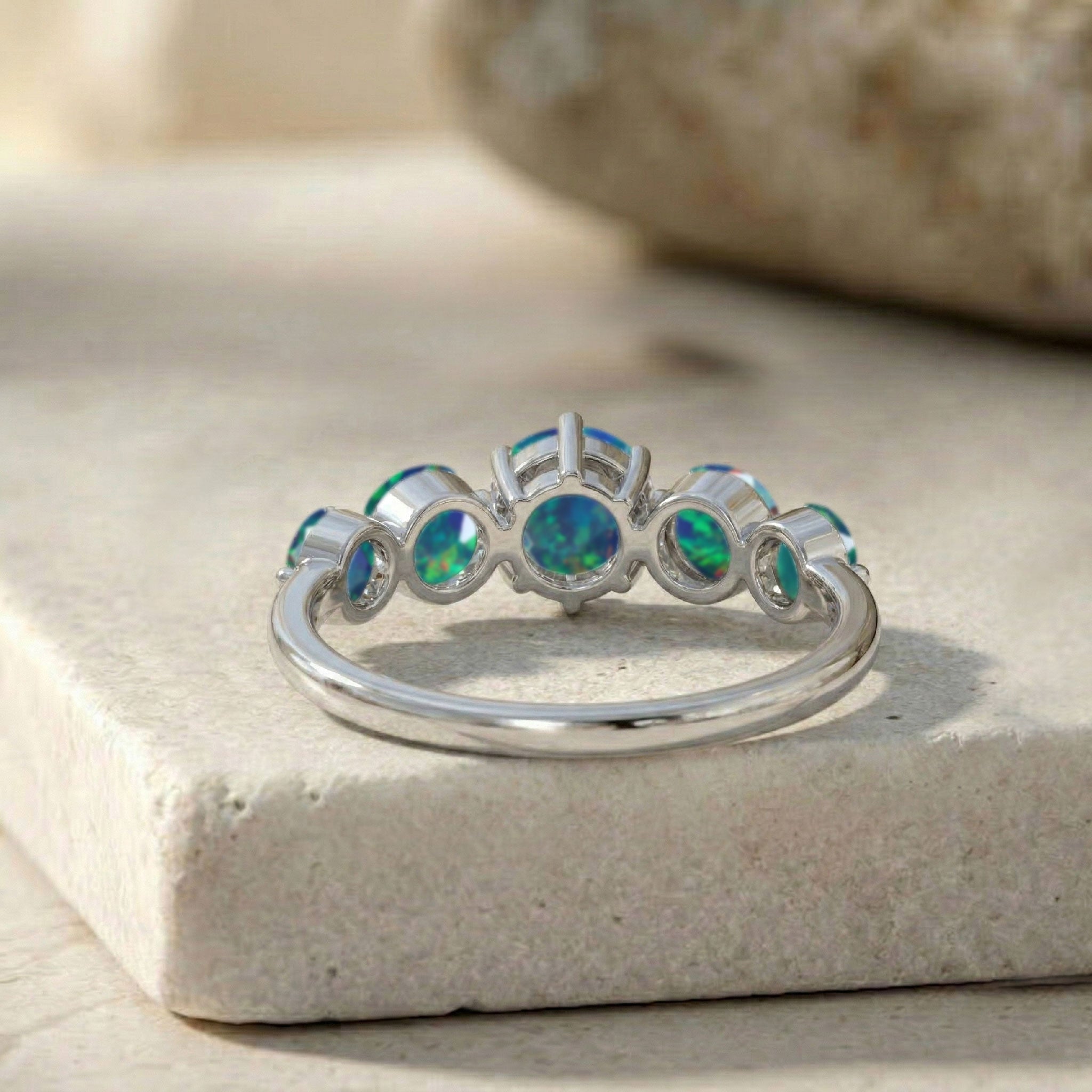 premium black opal jewellery, natural gemstone band, handcrafted women's ring, sterling silver artisan craftsmanship, polished luxury finish, elegant gemstone composition, colourful opal reflections, anniversary keepsake jewellery, refined styling, comfortable everyday ring, premium jewellery collection, statement gemstone band, timeless elegance, exclusive accessory, luxury design