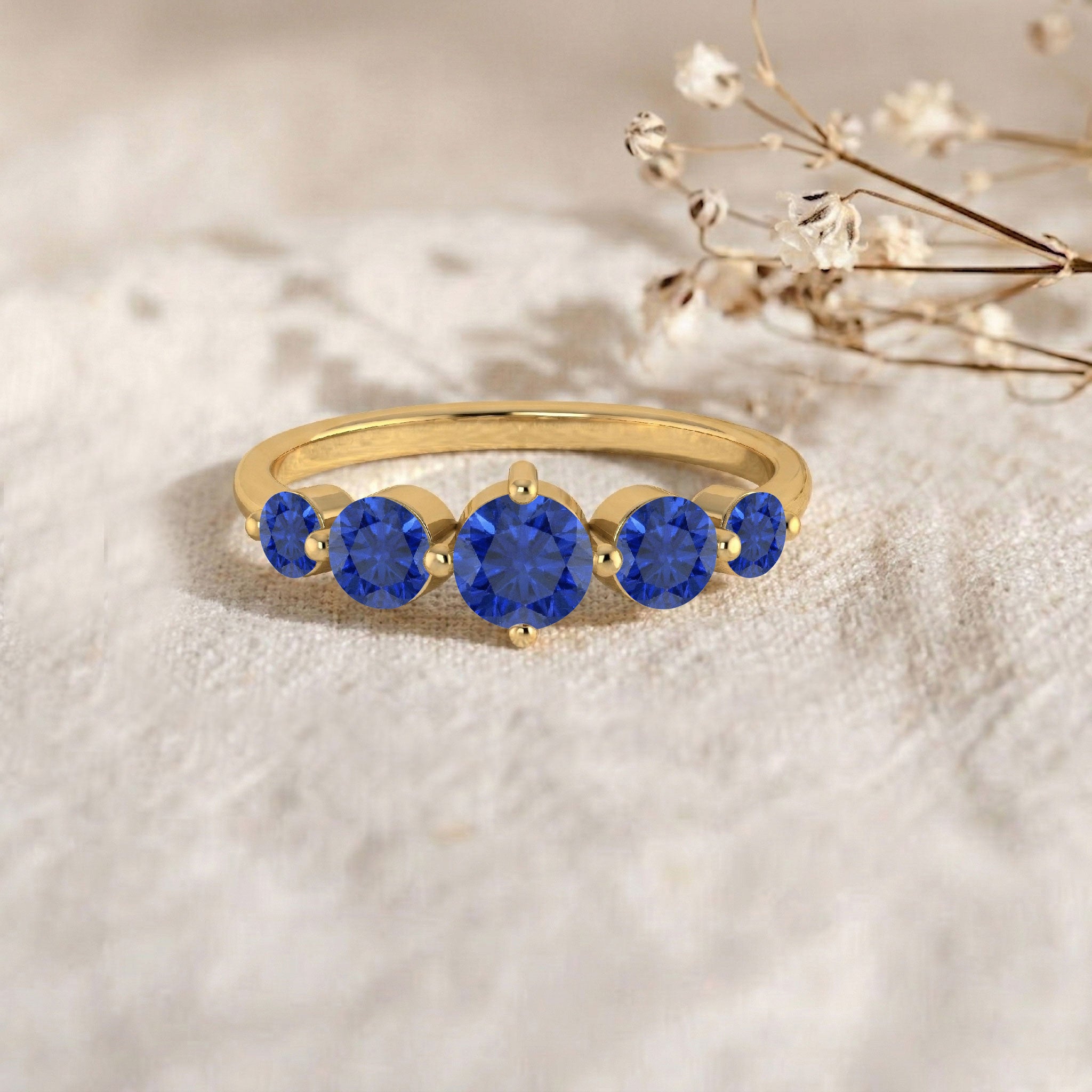 royal blue sapphire band, prong set gemstones, five gemstone ring, classic anniversary jewelry, elegant stacking ring, women's sapphire band, blue birthstone jewelry, luxury sapphire gift, fine crafted ring, minimalist elegance, sparkling gemstone band, stylish ring, everyday accessory, premium jewelry, timeless gift