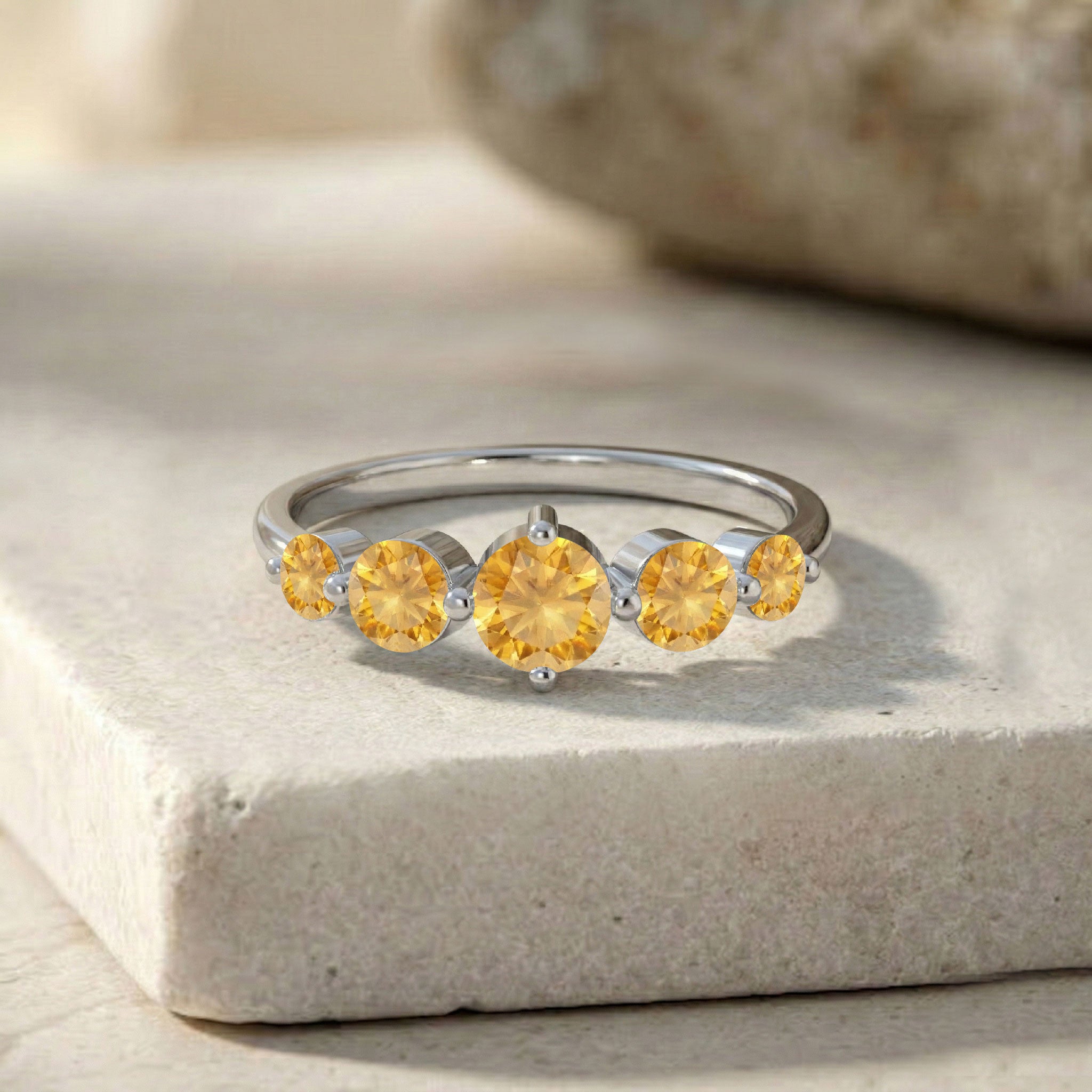five round citrine gemstones, natural gemstone band, handcrafted fine ring, polished sterling silver jewelry, premium yellow gold filled craftsmanship, elegant everyday accessory, sparkling golden gemstone shine, artisan fashion jewelry, sophisticated women's ring, luxury anniversary gift, stackable ring inspiration, timeless jewelry design, refined gemstone setting, comfortable band, heirloom inspired style