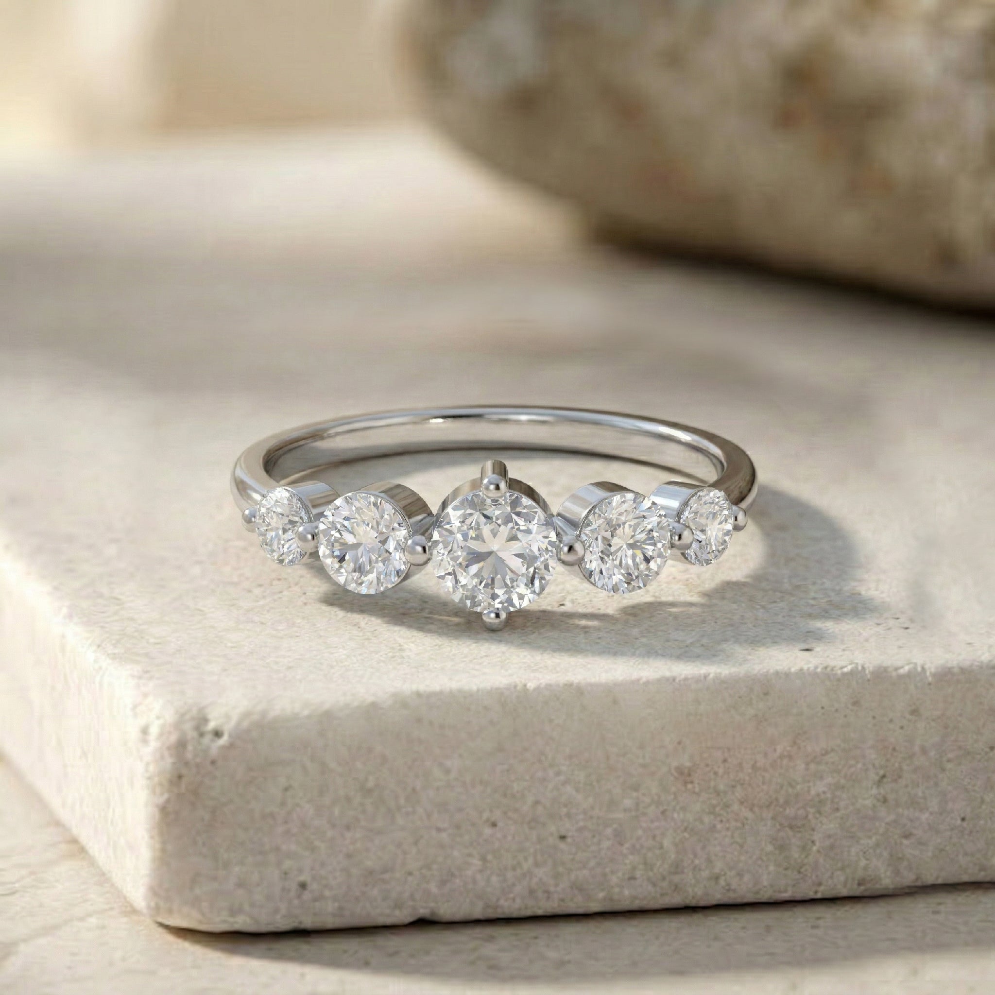 classic five stone band, round cut moissanite gemstones, slim polished shank, sterling silver jewelry gift, yellow gold jewelry design, elegant bridal band, luxurious everyday ring, premium sparkle, handcrafted artisan jewelry, anniversary keepsake, promise jewelry, refined gemstone arrangement, timeless elegance, feminine ring style, gift for her
