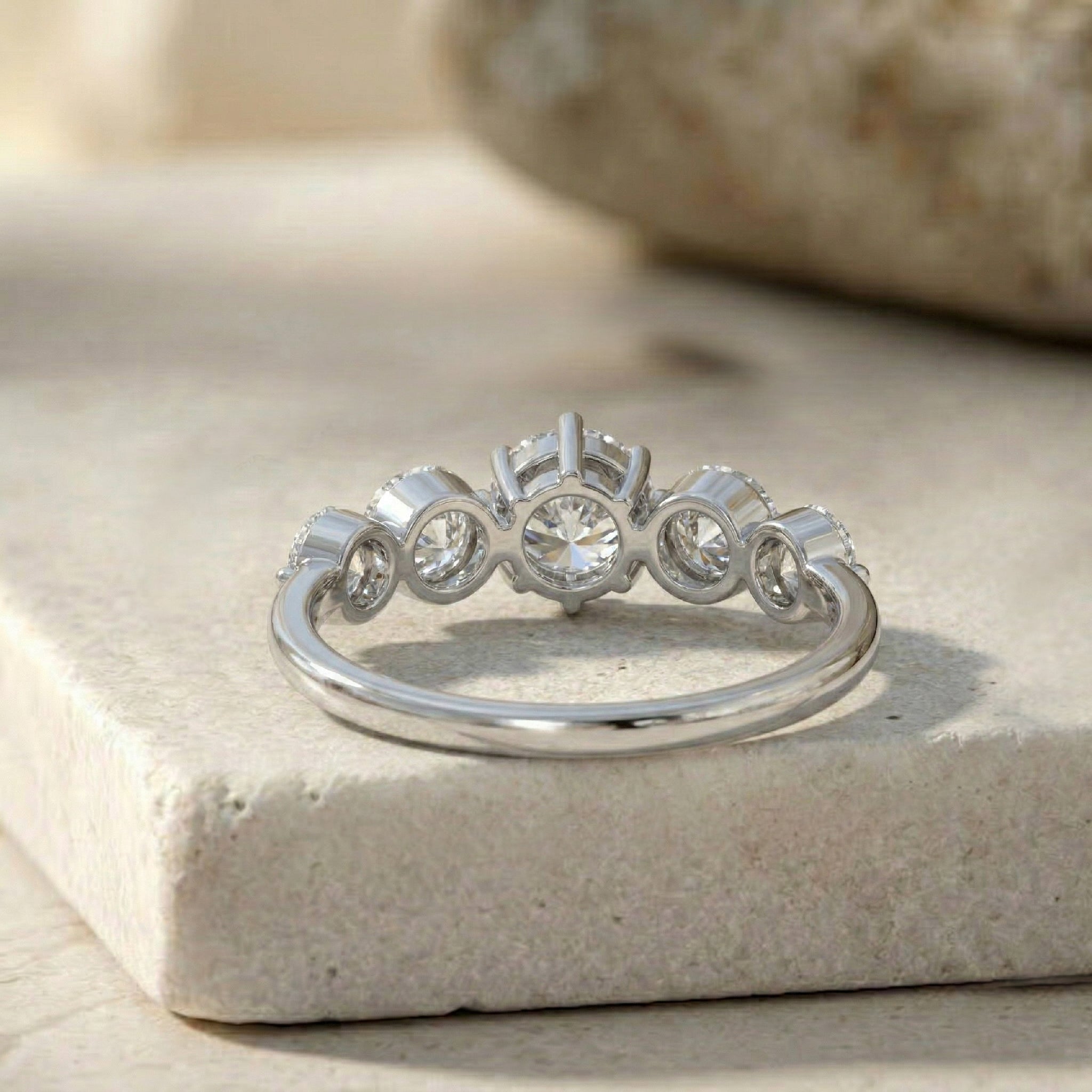fine jewelry moissanite ring, elegant shared setting, round faceted gemstones, premium polished finish, sterling silver craftsmanship, gold filled luxury, bridal anniversary jewelry, everyday elegant accessory, timeless women's band, handcrafted gemstone artistry, sophisticated sparkle, refined fashion jewelry, modern heirloom ring, graceful stacking piece, luxury gift inspiration