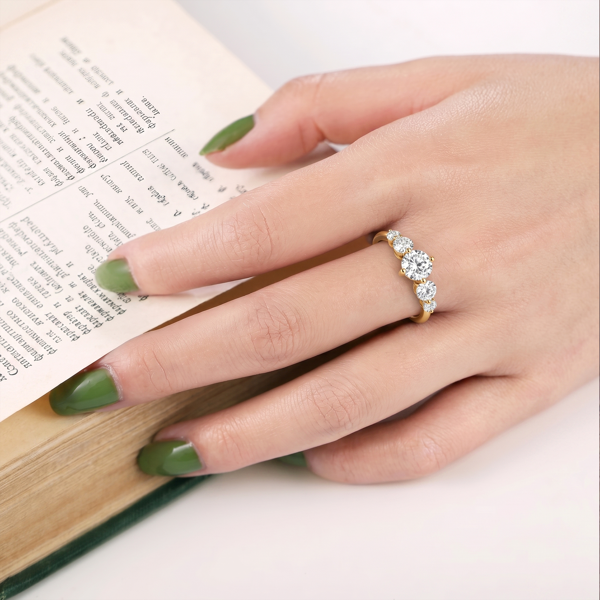 graduated round moissanite stones, elegant five stone ring, shared claw setting, premium sterling silver jewelry, polished yellow gold filled band, bridal elegance, promise ring inspiration, anniversary keepsake jewelry, luxury stacking accessory, handcrafted gemstone ring, refined silhouette, everyday glamour, classic sophistication, sparkling fine jewelry, women's gift
