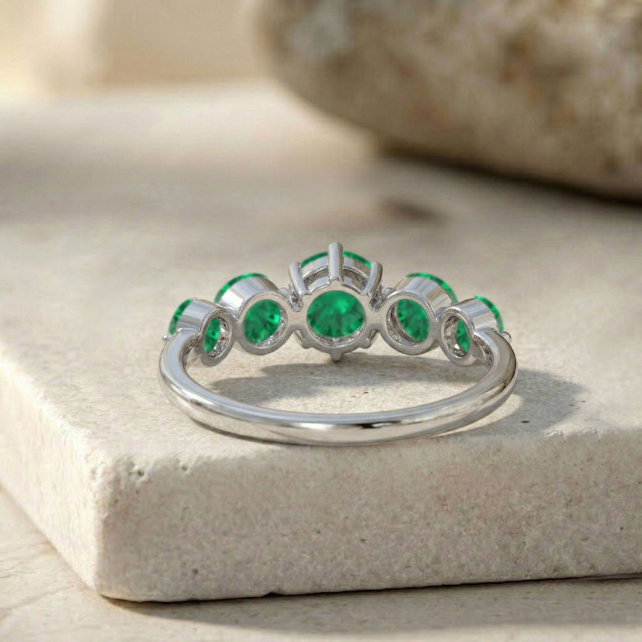 Emerald prong set ring, five brilliant round gemstones, sterling silver designer jewelry, yellow gold filled classic ring, emerald stacking accessory, refined green gemstone band, handcrafted anniversary jewelry, polished luxury finish, premium emerald statement ring, fashionable everyday jewelry, women's elegant accessory, sophisticated gemstone ring, timeless bridal design, artisan craftsmanship, sparkling emerald gift