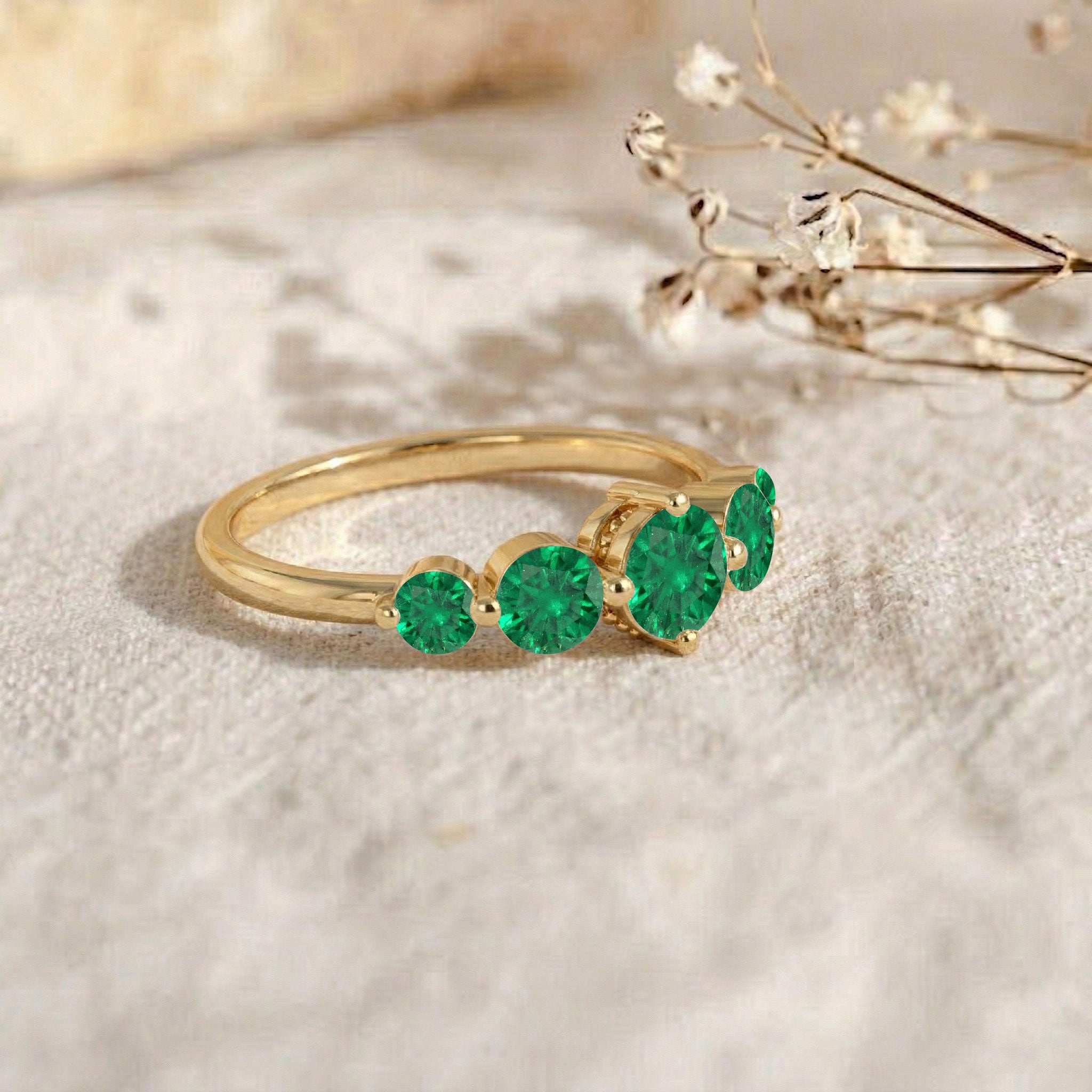 Bright emerald gemstone ring, graduated round stone band, emerald stacking jewelry, sterling silver wedding band, yellow gold filled fashion ring, luxury emerald gift, handcrafted gemstone band, sophisticated emerald ring, refined jewelry design, modern women's ring, sparkling green stones, classic band style, anniversary present, elegant craftsmanship, designer jewelry