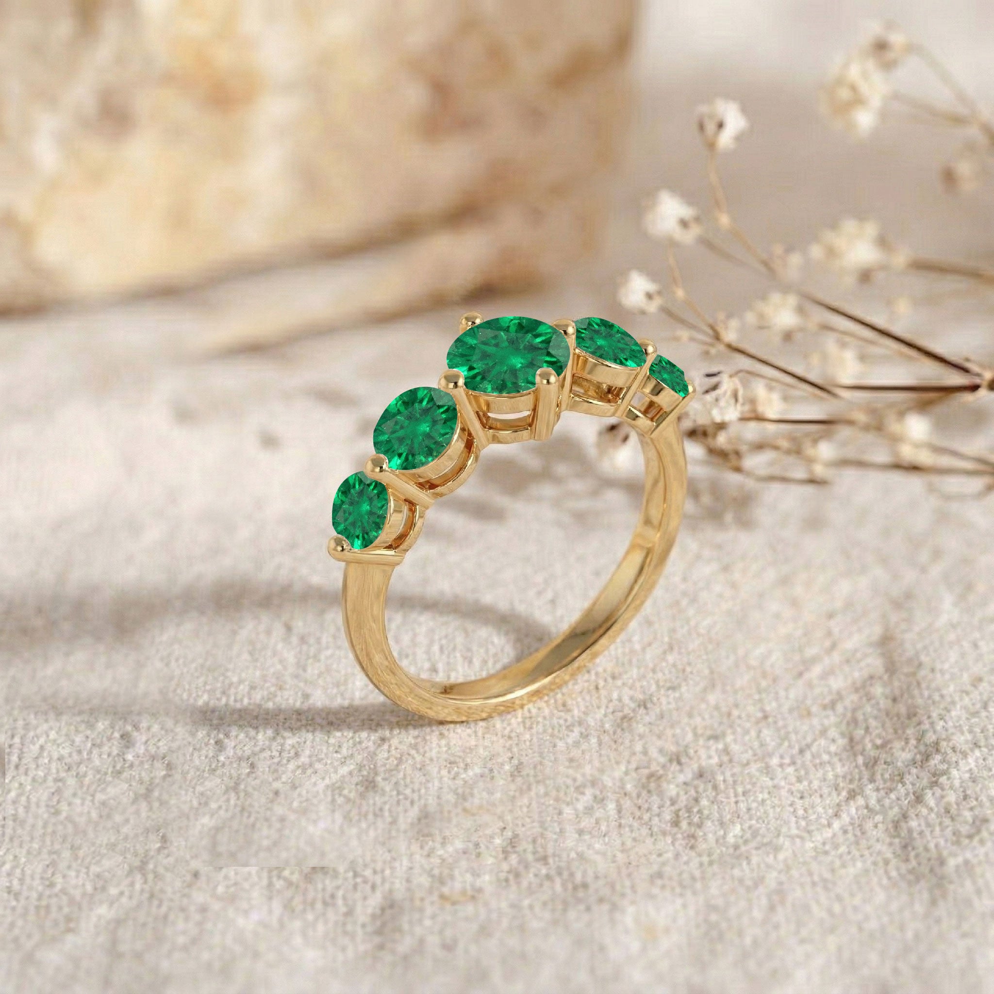Five stone emerald ring design, emerald gemstone fashion jewelry, sterling silver polished band, yellow gold filled luxury jewelry, brilliant green gemstones, artisan crafted ring, elegant stackable accessory, anniversary celebration ring, timeless bridal jewelry, modern emerald style, comfortable everyday band, premium gemstone setting, fashionable women's jewelry, sparkling emerald beauty, fine craftsmanship