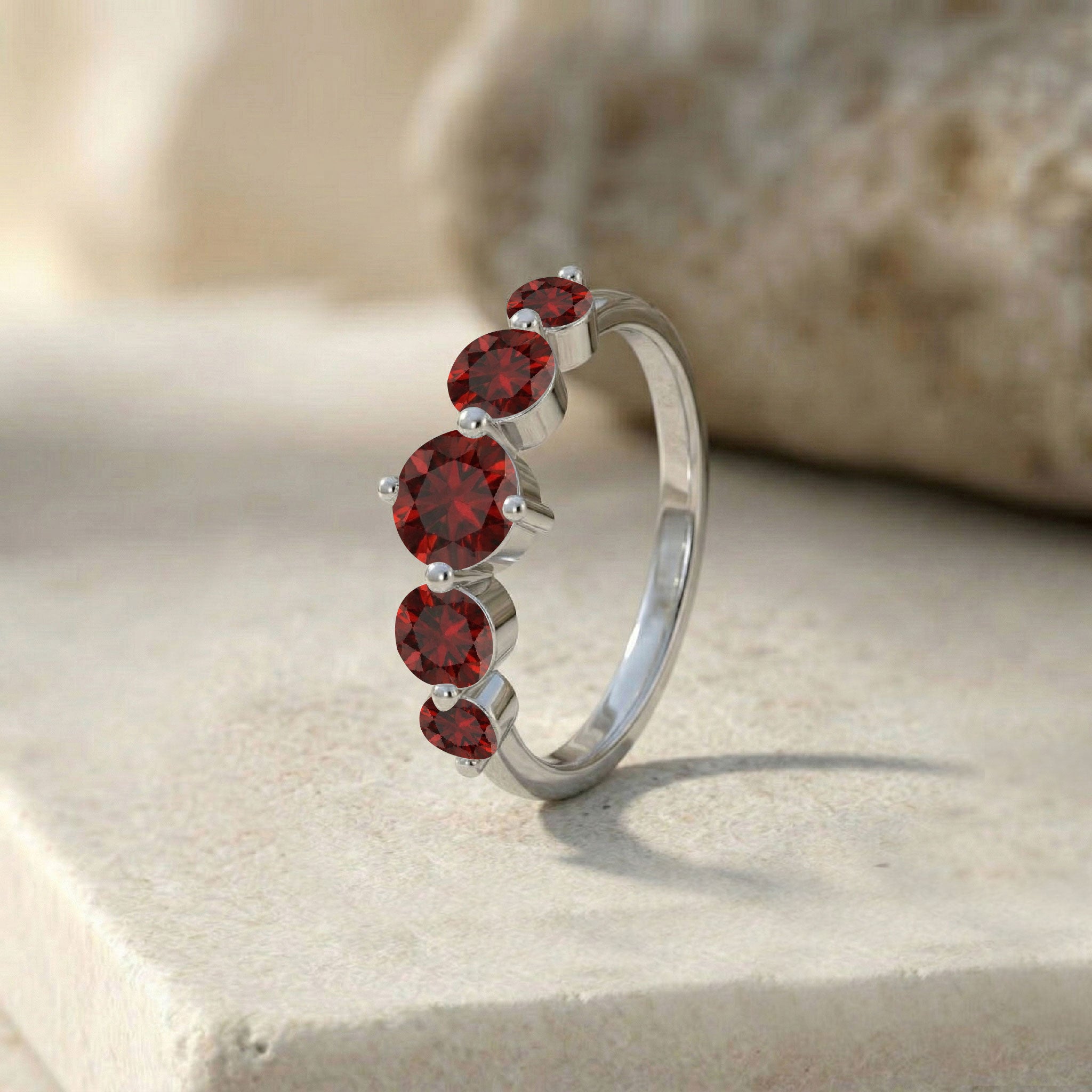 classic garnet band ring, brilliant red gemstone jewelry, five stone stacking ring, sterling silver contemporary design, yellow gold filled polished band, handcrafted fine accessory, elegant bridal jewelry, January birthday present, refined gemstone fashion, luxurious ring profile, sparkling round garnets, sophisticated women's ring, premium jewelry design, timeless elegance, artisan quality