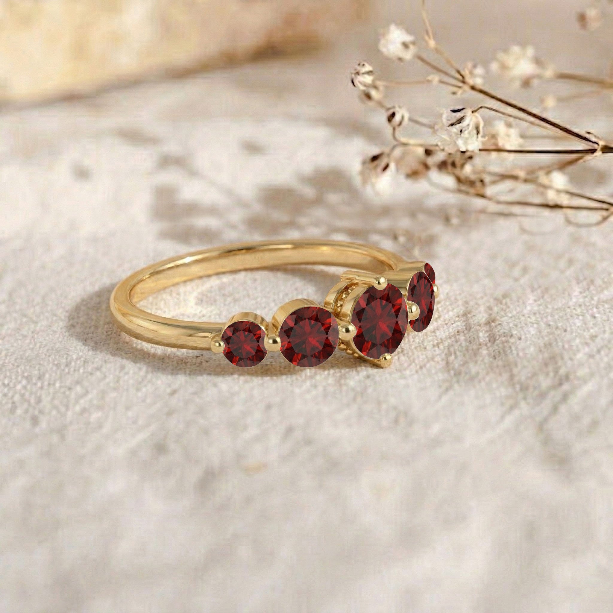 garnet statement ring, graduated gemstone arrangement, sterling silver artisan jewelry, gold filled luxury band, refined red gemstone ring, handcrafted stacking accessory, women's anniversary jewelry, elegant promise band, polished minimalist ring, brilliant round cut stones, sophisticated bridal jewelry, fashionable gemstone ring, timeless craftsmanship, luxury gift, fine jewelry collection