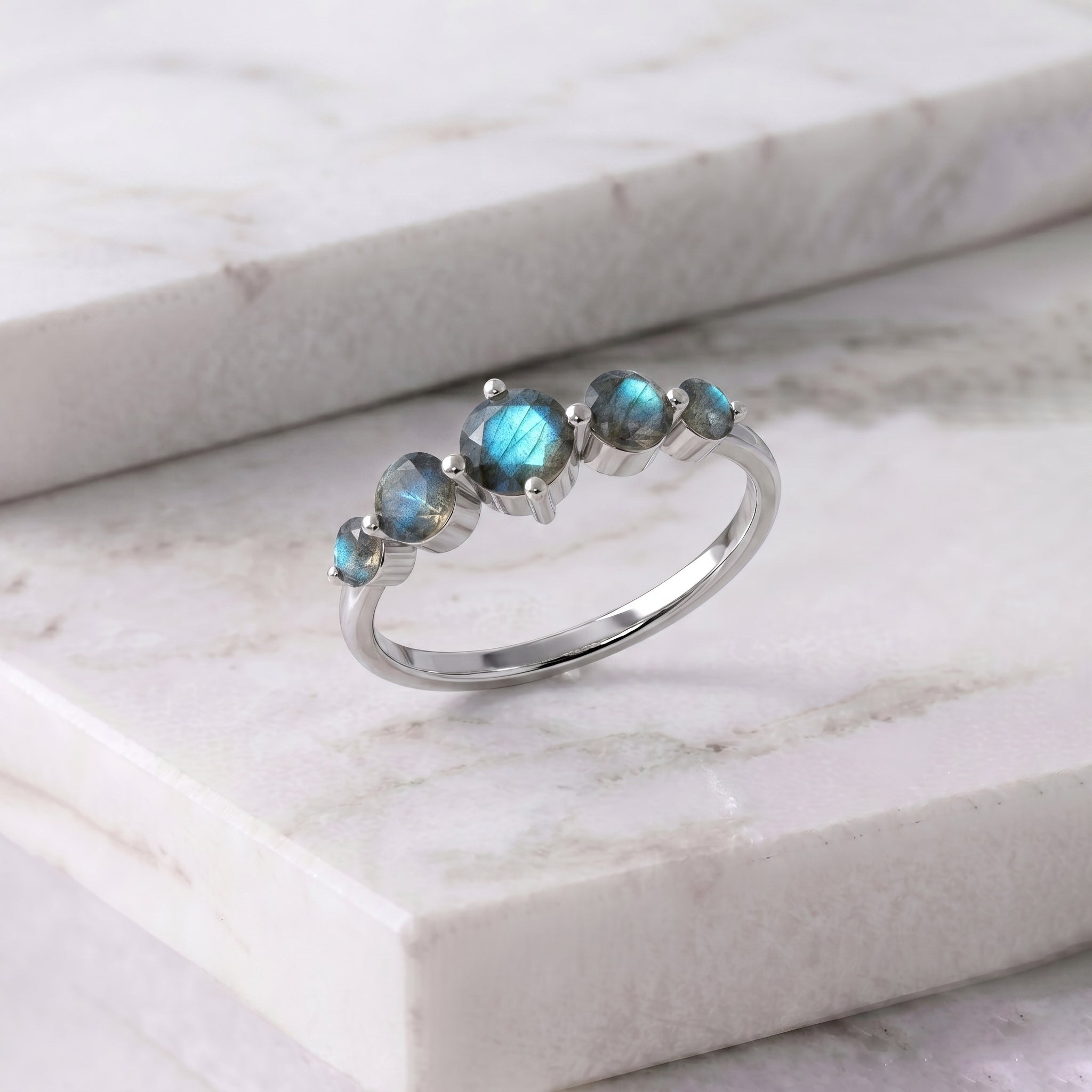 natural labradorite gemstone band, handcrafted five stone setting, sterling silver ring design, gold filled jewelry option, faceted round gemstone jewelry, blue iridescent sparkle, elegant stacking accessory, artisan luxury ring, women's birthday jewelry, polished designer craftsmanship, timeless gemstone band, anniversary keepsake, fine handmade jewelry, premium fashion ring, contemporary elegance