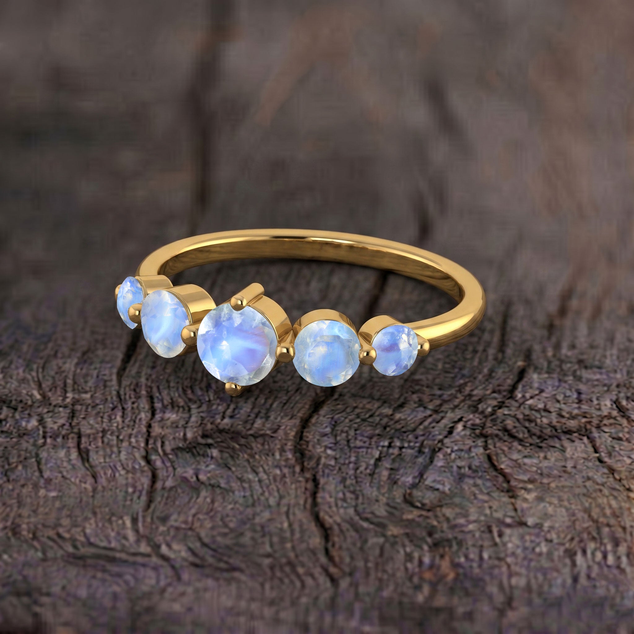round moonstone ring for women, natural gemstone ring, handcrafted silver jewelry, yellow gold filled accessory, elegant five stone setting, June birthstone jewelry, artisan gemstone craftsmanship, luxury stacking ring, polished ring, timeless fine jewelry, bridal gift, birthday present, feminine jewelry collection, glowing gemstone design, refined accessory