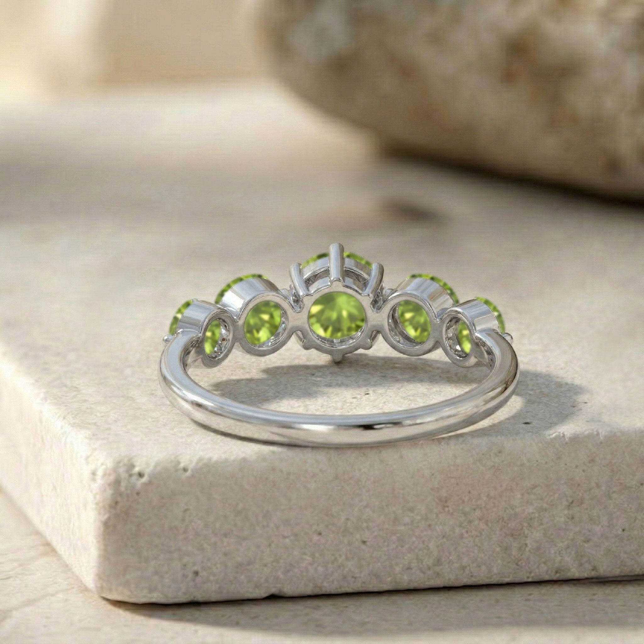 five gemstone crown ring, vivid green round peridot, polished artisan jewellery, sterling silver elegance, luxurious yellow gold finish, handcrafted premium accessory, refined gemstone brilliance, modern ring architecture, elegant jewellery styling, women's anniversary jewellery, colourful statement band, comfortable luxury ring, sophisticated craftsmanship, exclusive jewellery design, premium fashion ring
