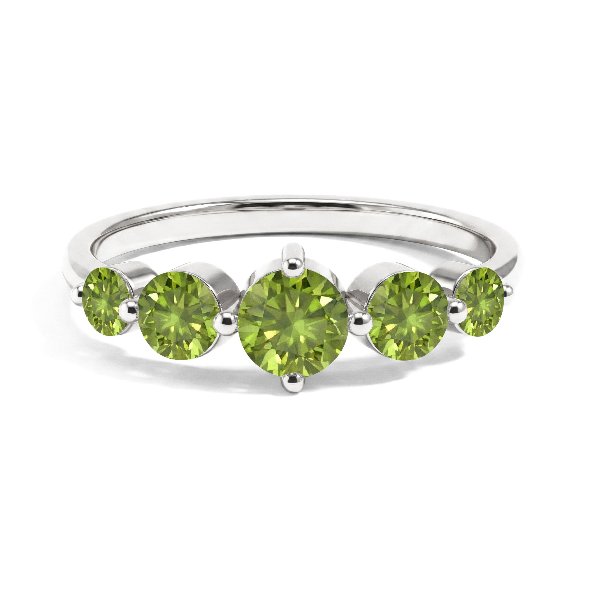 crown inspired peridot ring, graduated green gemstone design, elevated centre stone, natural peridot jewellery, royal silhouette band, sterling silver craftsmanship, yellow gold filled option, contemporary fine jewellery, artisan gemstone ring, elegant fashion accessory, statement jewellery, polished band, handcrafted luxury ring, August birthstone, premium women's jewellery