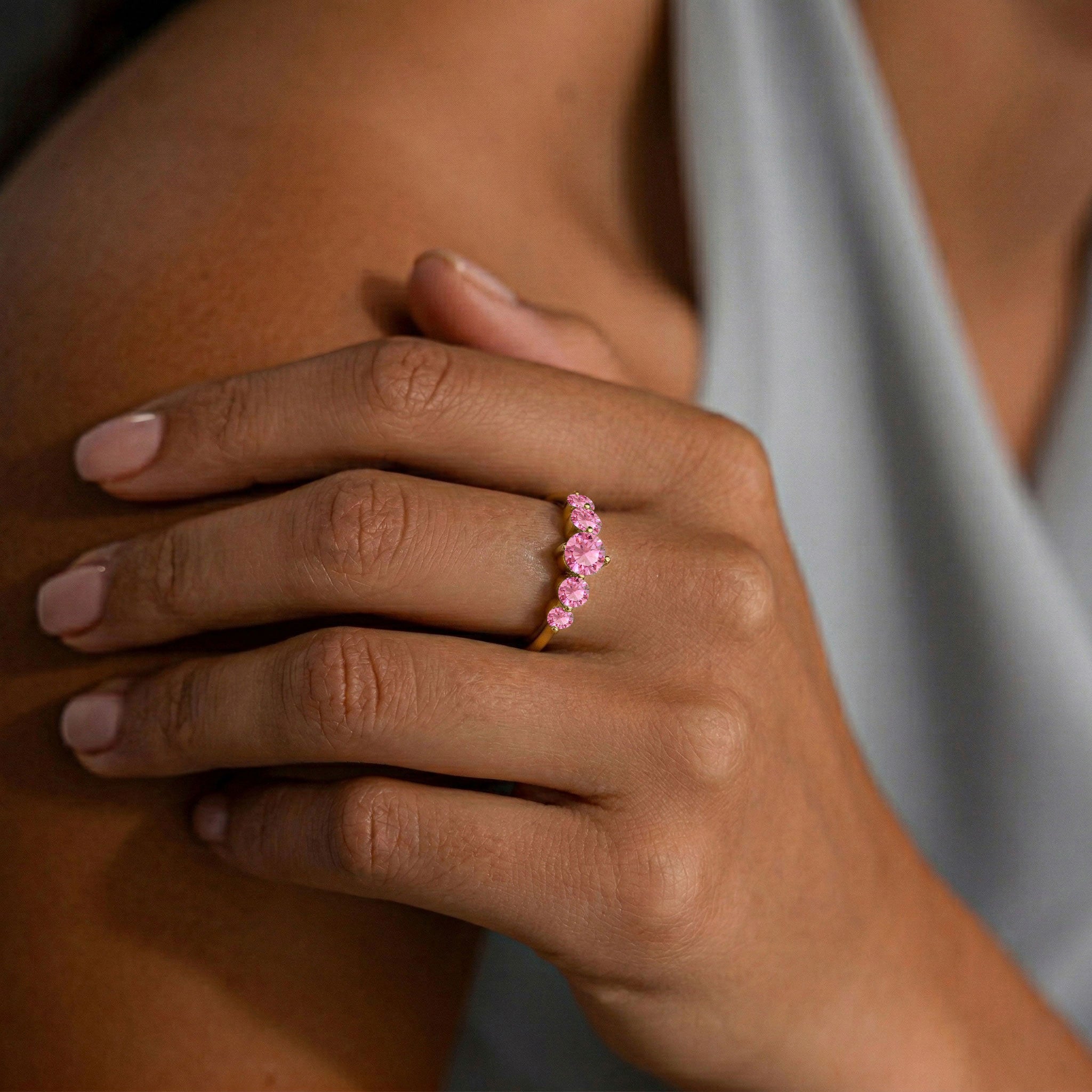 pink gemstone fashion ring, handcrafted premium jewellery, sterling silver artisan band, polished gold filled finish, elegant gemstone arrangement, women's luxury accessory, refined jewellery collection, sophisticated ring design, colourful gemstone jewellery, comfortable everyday ring, premium craftsmanship, timeless style, exclusive ring, feminine accessory, fine jewellery