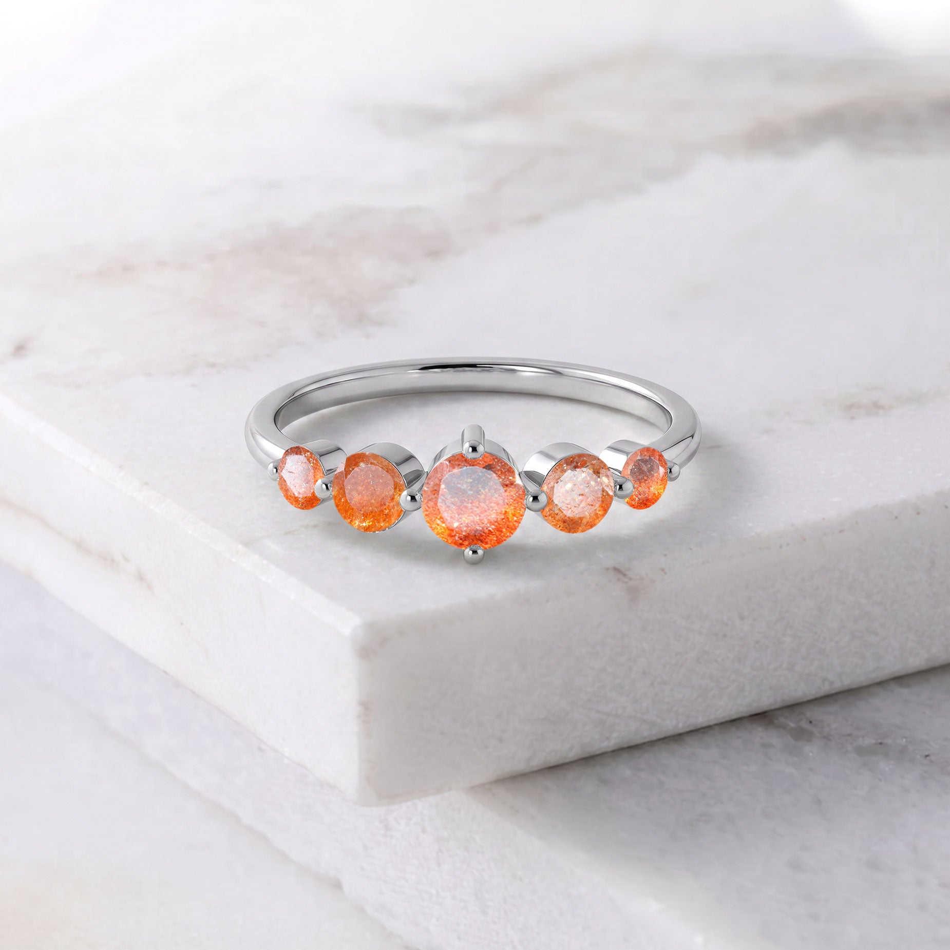 orange gemstone fashion jewelry, natural sunstone sparkle, five stone jewelry design, sterling silver luxury jewelry, yellow gold filled craftsmanship, handcrafted women's accessory, elegant anniversary ring, bridal fashion jewelry, polished gemstone setting, refined elegance, premium jewelry design, timeless gift, feminine style, artisan quality, sparkling gemstones