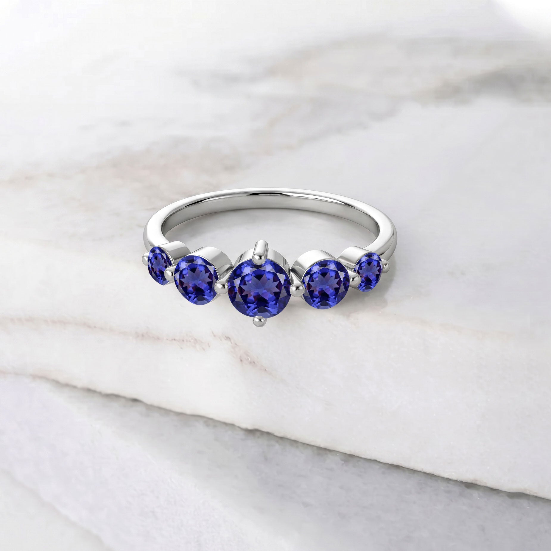 tanzanite statement jewelry, sterling silver handcrafted elegance, yellow gold filled jewelry craftsmanship, five gemstone arrangement, polished luxury setting, december birthday present, elegant women's ring, artisan gemstone design, refined accessory, premium quality jewelry, sophisticated style, timeless fashion, anniversary gift, violet gemstone jewelry, handcrafted design