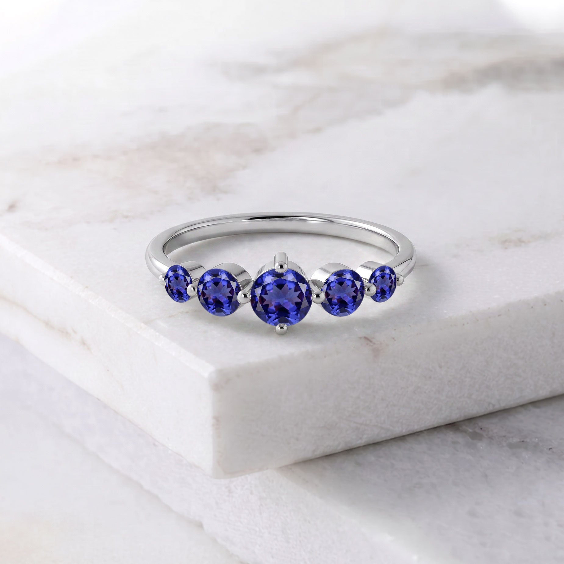 violet blue gemstone ring, tanzanite anniversary jewelry, handcrafted luxury craftsmanship, sterling silver elegance, yellow gold filled jewelry option, five gemstone design, polished artisan setting, elegant bridal jewelry, refined fashion accessory, premium quality gemstones, classic jewelry, meaningful birthday gift, everyday luxury, women's fine jewelry, sophisticated beauty