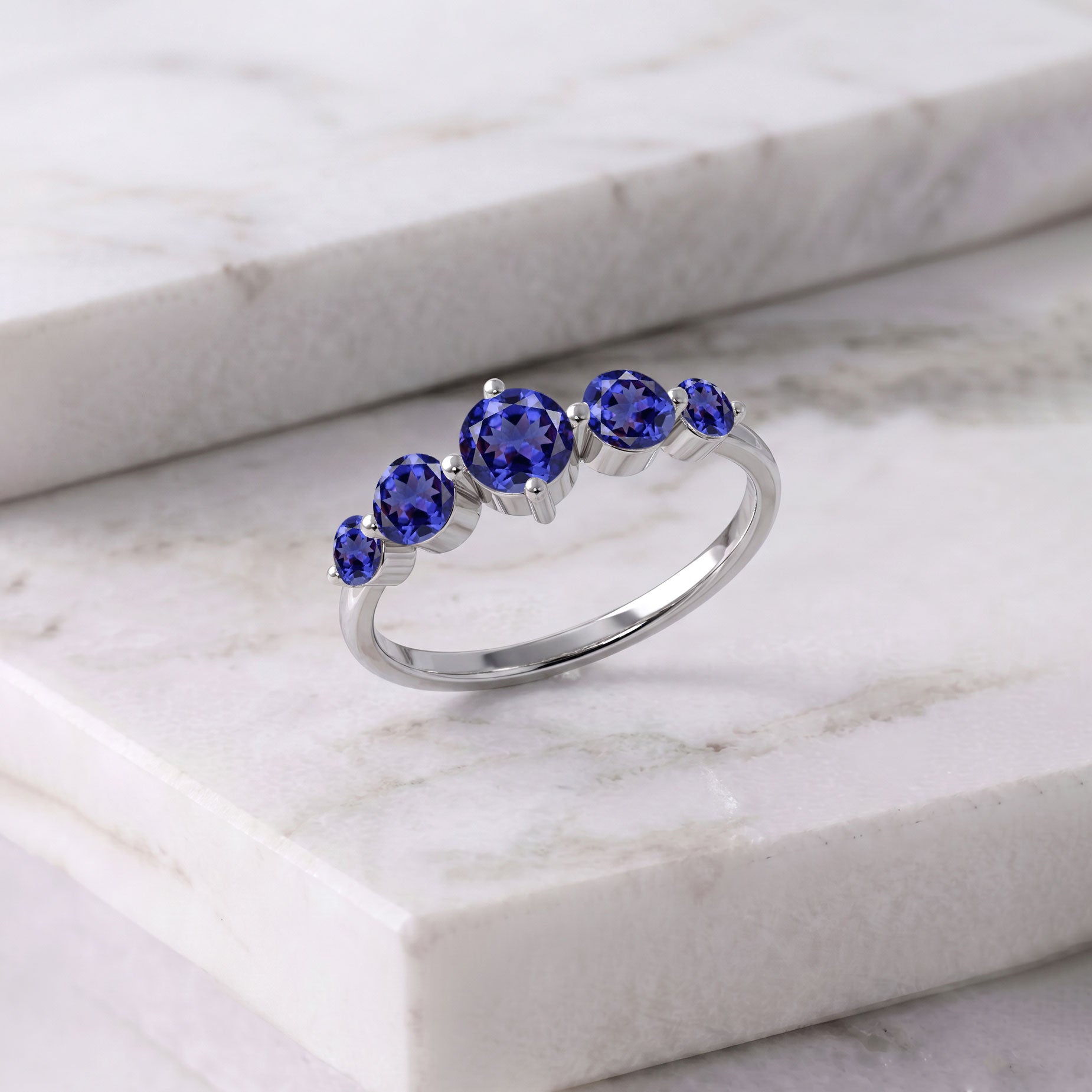december gemstone jewelry, handcrafted tanzanite ring, sterling silver luxury craftsmanship, yellow gold filled polished finish, five gemstone elegance, refined women's jewelry, anniversary gift idea, artisan made accessory, premium jewelry collection, violet gemstone brilliance, sophisticated style, timeless beauty, elegant fashion accessory, handcrafted gemstone artistry, meaningful luxury