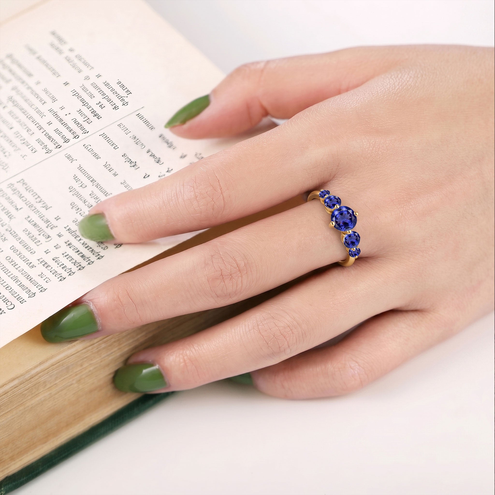 tanzanite jewelry for women, handcrafted fine jewelry, sterling silver polished ring, yellow gold filled craftsmanship, december gemstone gift, refined gemstone arrangement, elegant anniversary jewelry, promise jewelry, premium artisan quality, sophisticated fashion accessory, timeless elegance, luxury jewelry collection, polished gemstone sparkle, feminine design, modern style