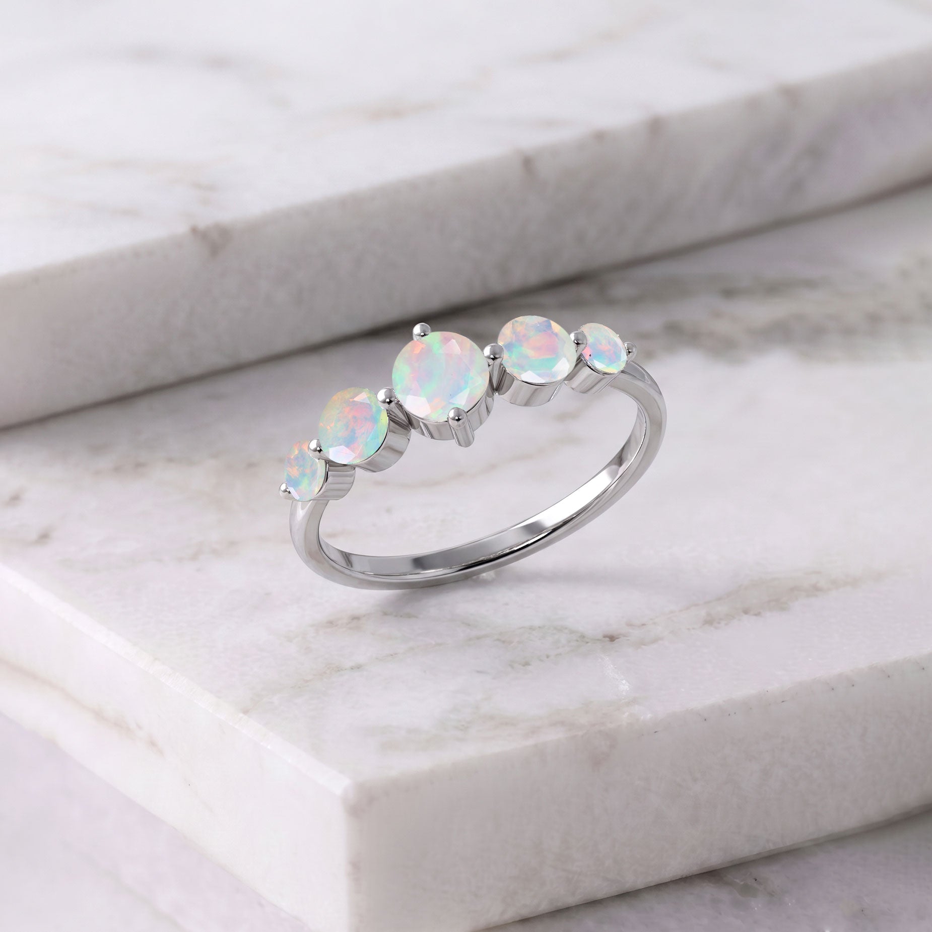 white opal fine jewelry, october gemstone accessory, polished round gemstones, elegant jewelry design, luxury silver ring, gold filled craftsmanship, artisan gemstone setting, colorful play of color, wedding jewelry inspiration, anniversary keepsake, feminine elegance, handcrafted accessory, premium gemstone jewelry, everyday style, timeless fashion, unique design, modern sophistication, bridal favorite, jewelry lover gift, refined elegance