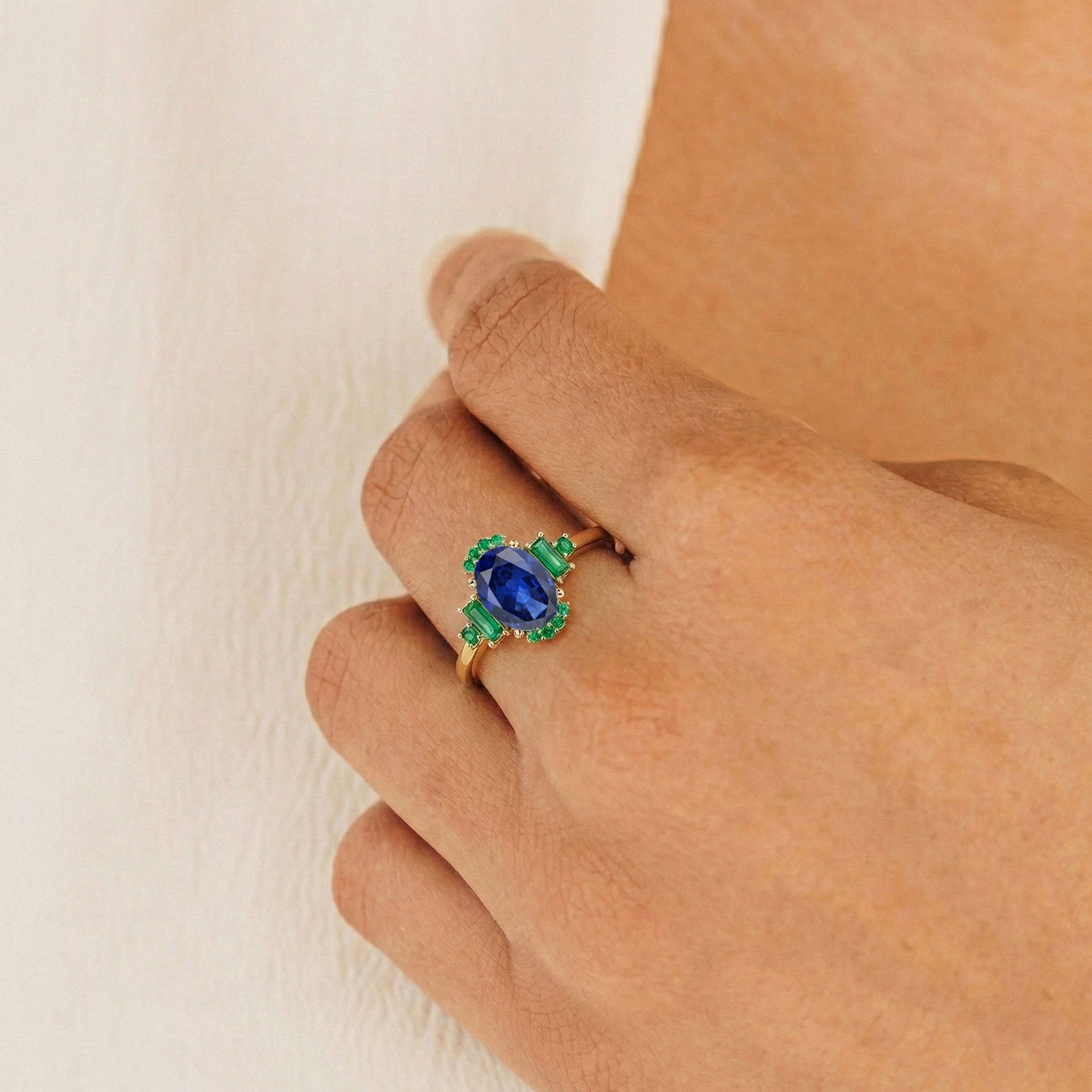 Close up blue sapphire gemstone ring with emerald side stones 1.2 carat jewelry