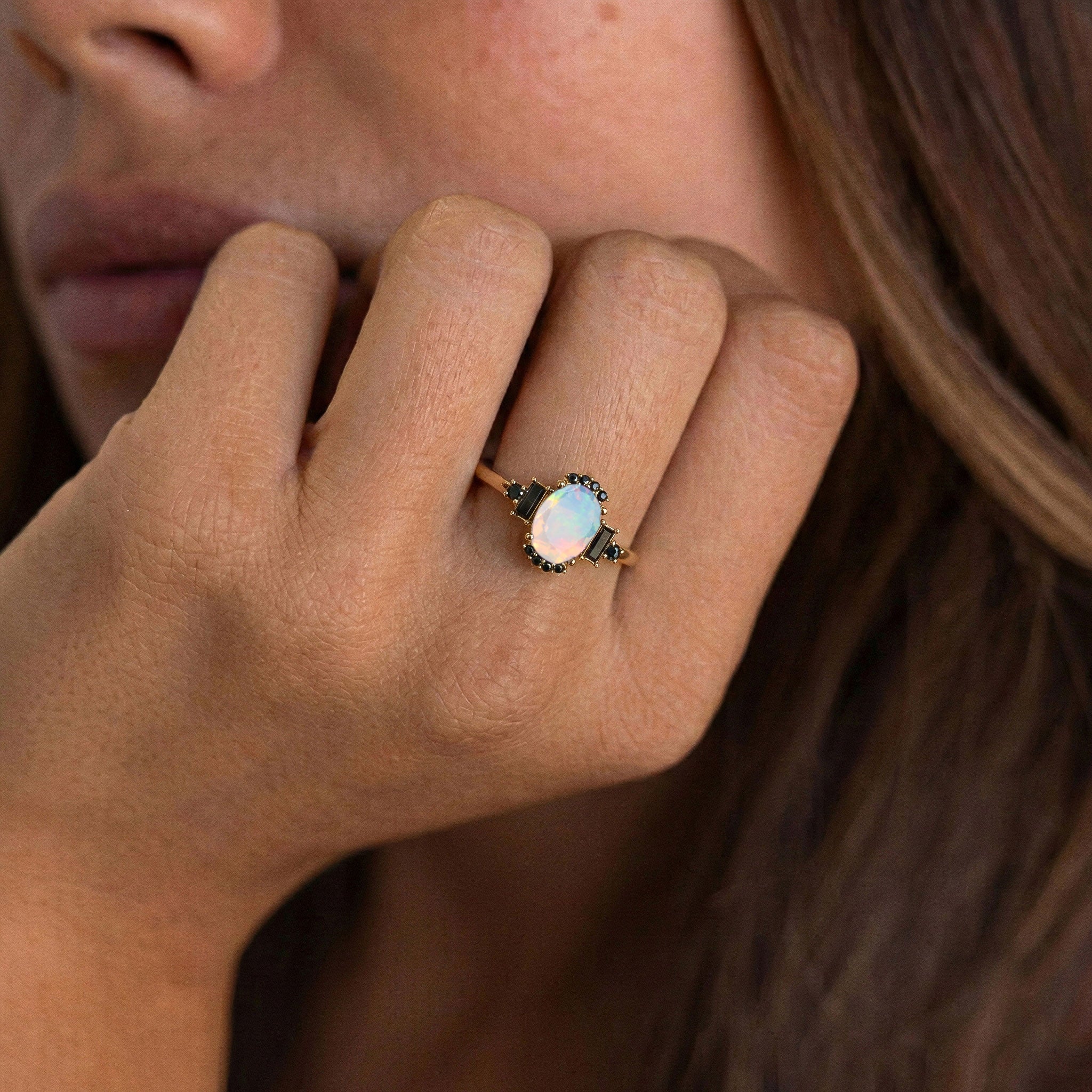 Elegant bridal engagement ring featuring white opal and onyx in sterling silver jewelry