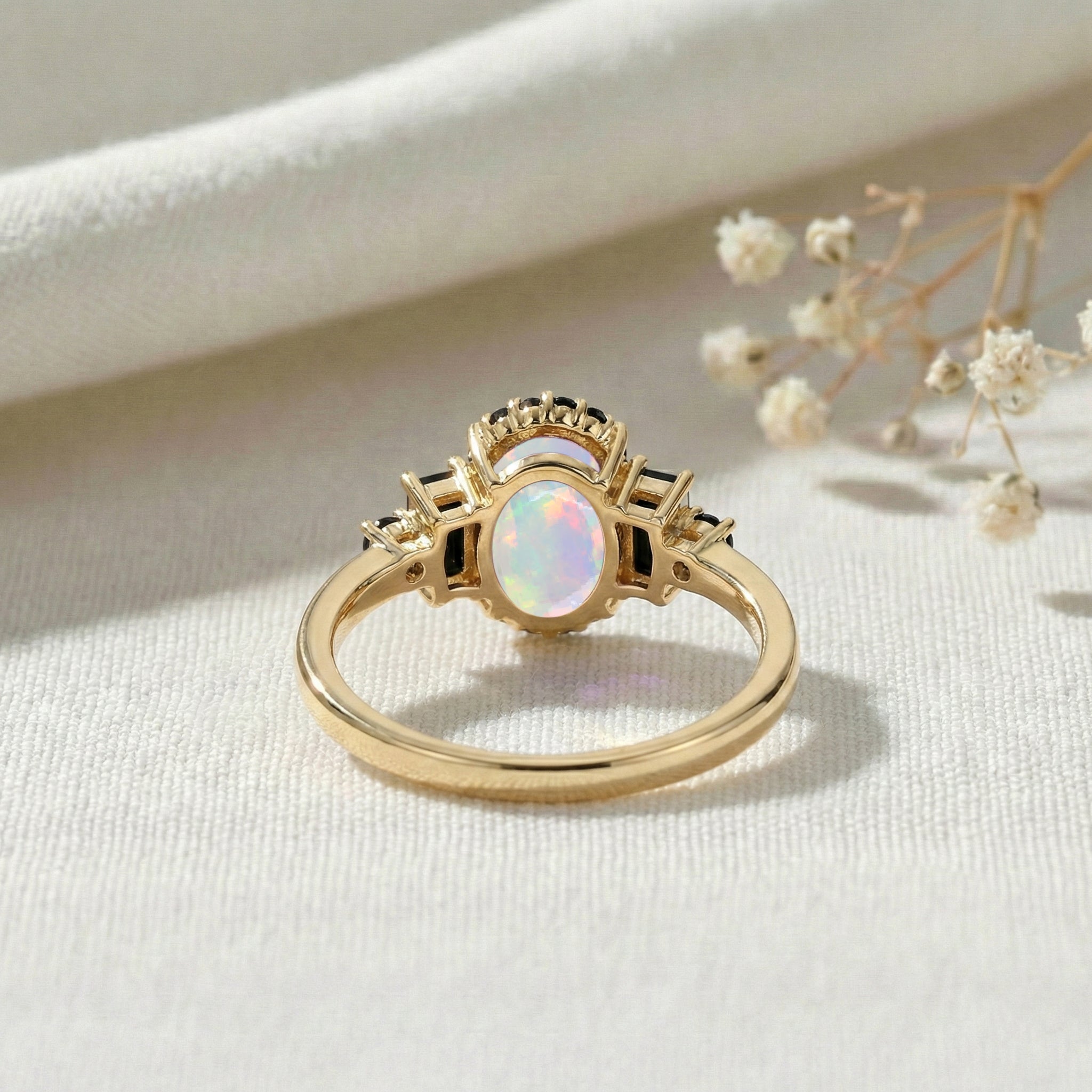 Luxury gemstone engagement ring with white opal and black onyx stones in sterling silver