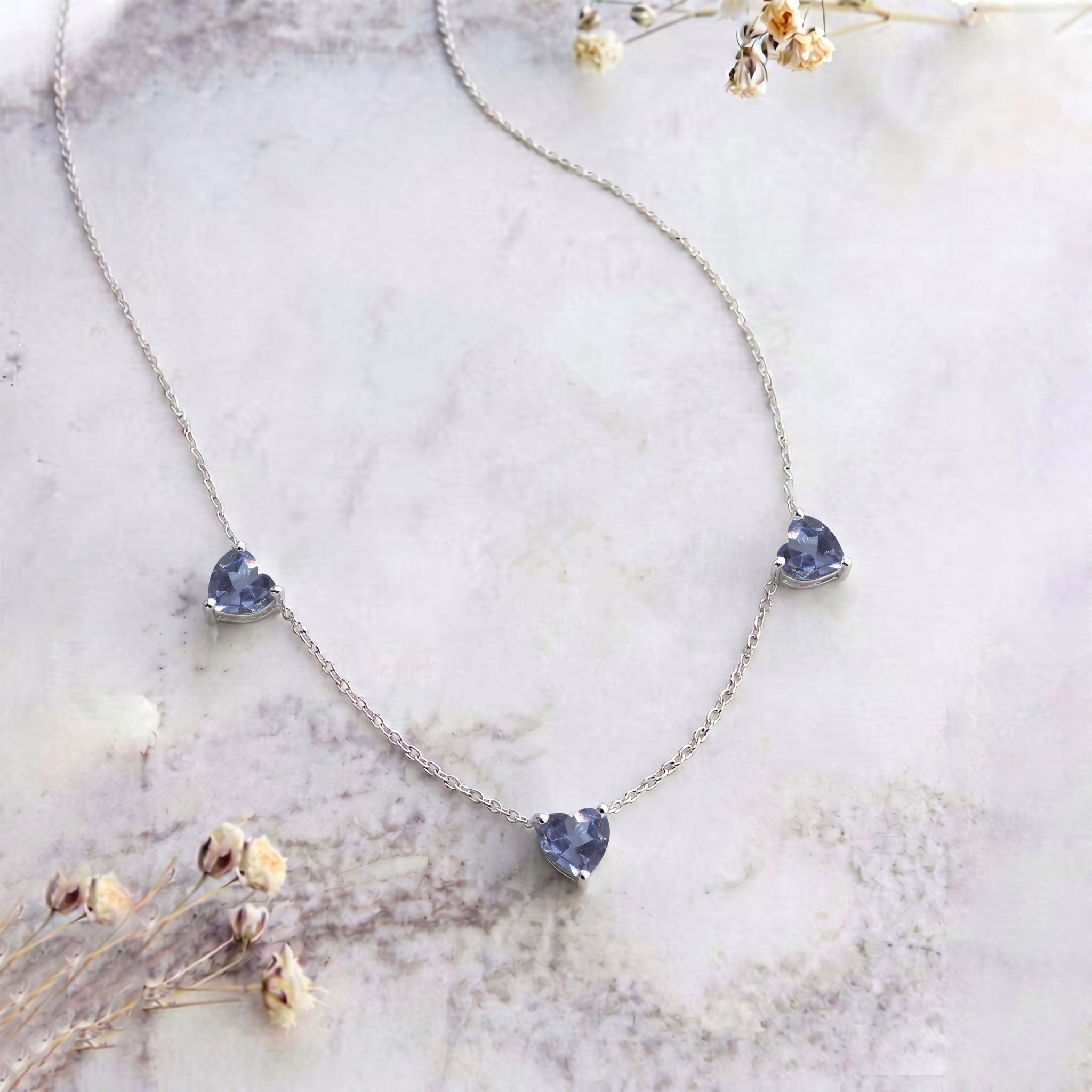 Genuine AAA Alexandrite Heart Necklace with three 6mm heart-cut gemstones.
