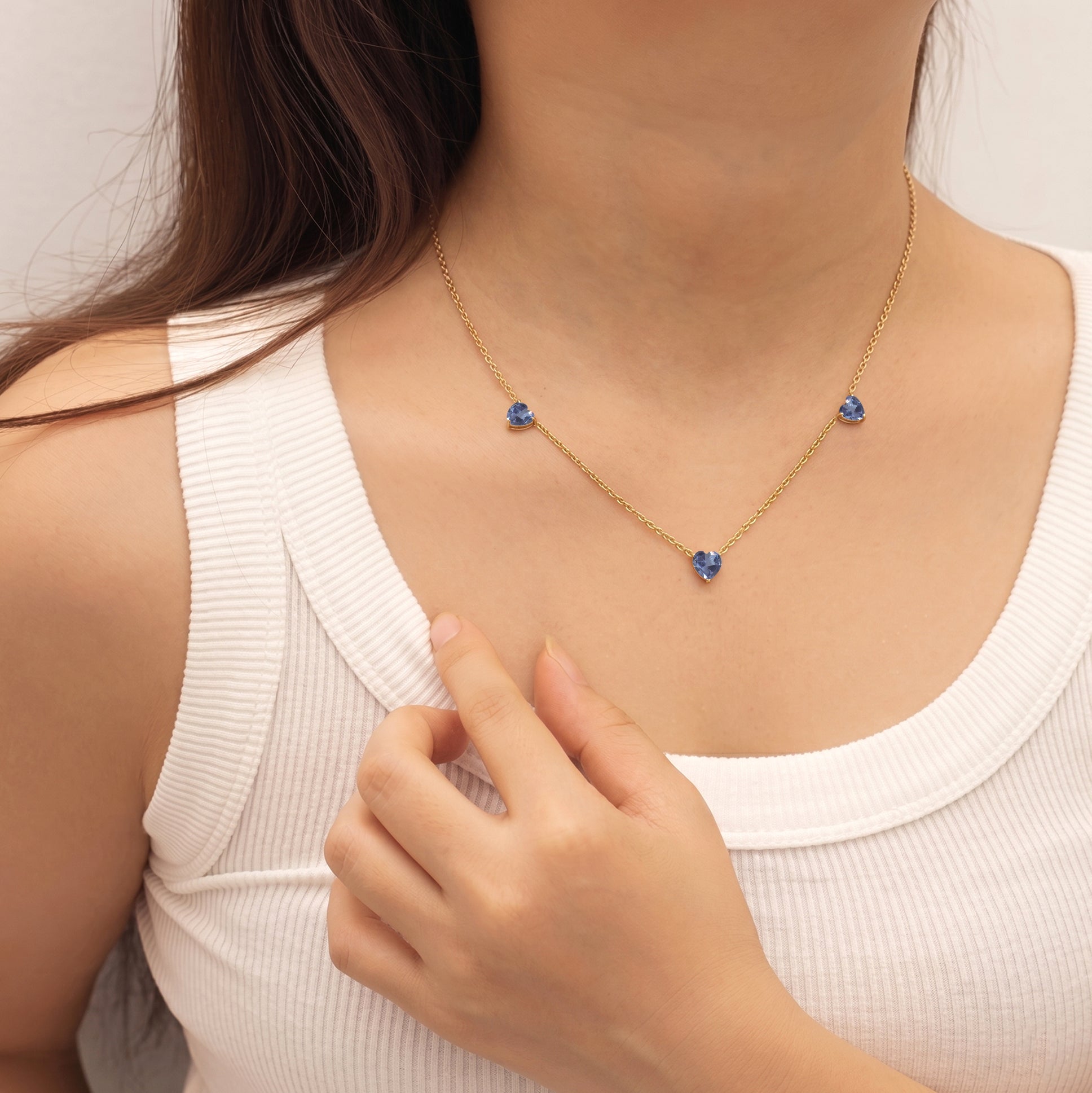 Handmade Alexandrite Three Stone Heart Necklace with color-changing gemstones in Yellow Gold Filled.
