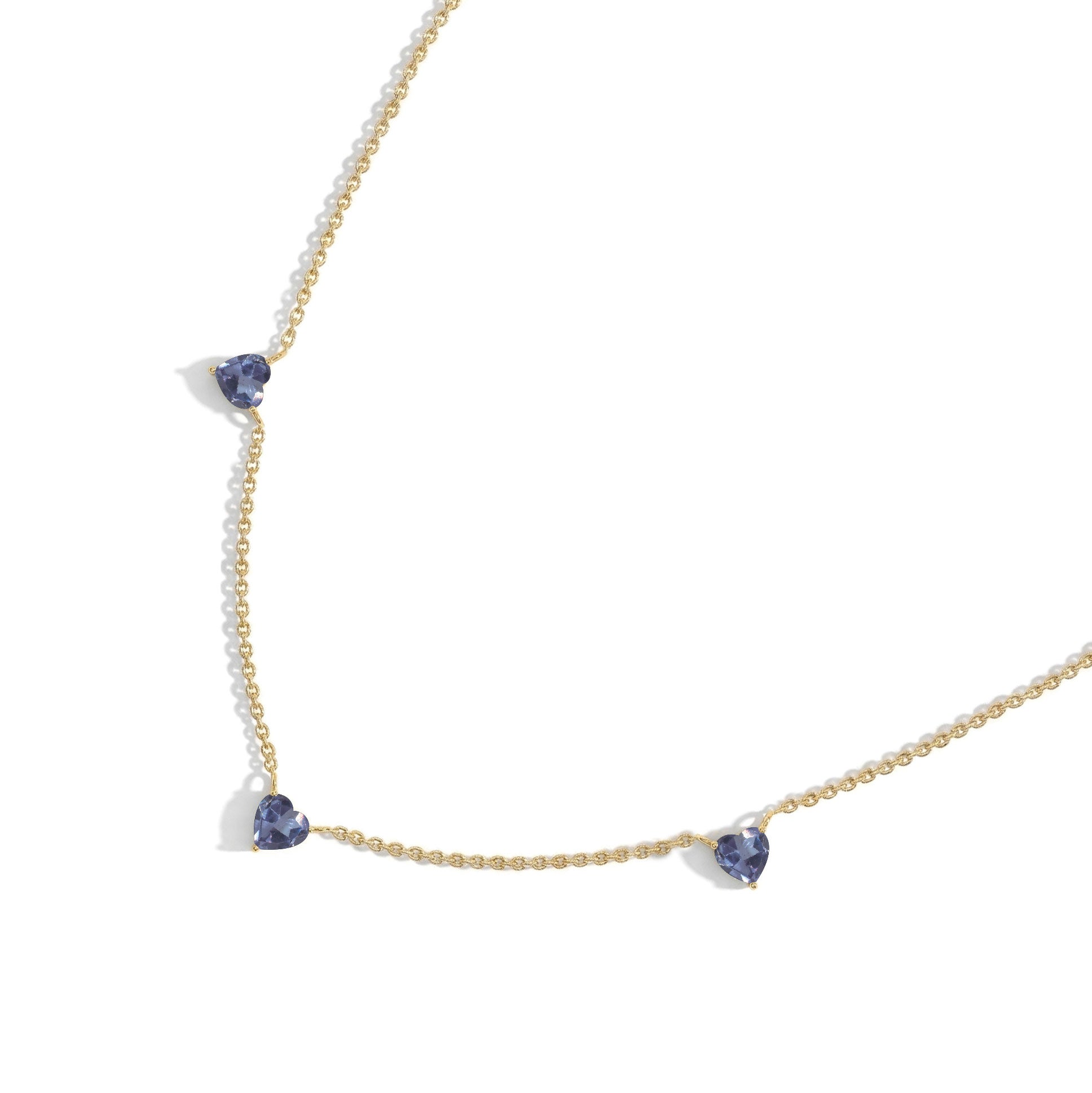 Fine jewelry Alexandrite necklace with three heart-shaped gemstones.
