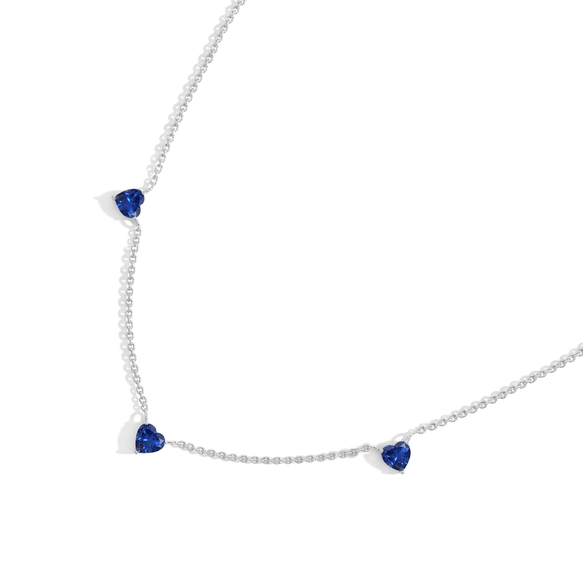 Handmade Blue Sapphire Three Stone Heart Necklace in Yellow Gold Filled.
