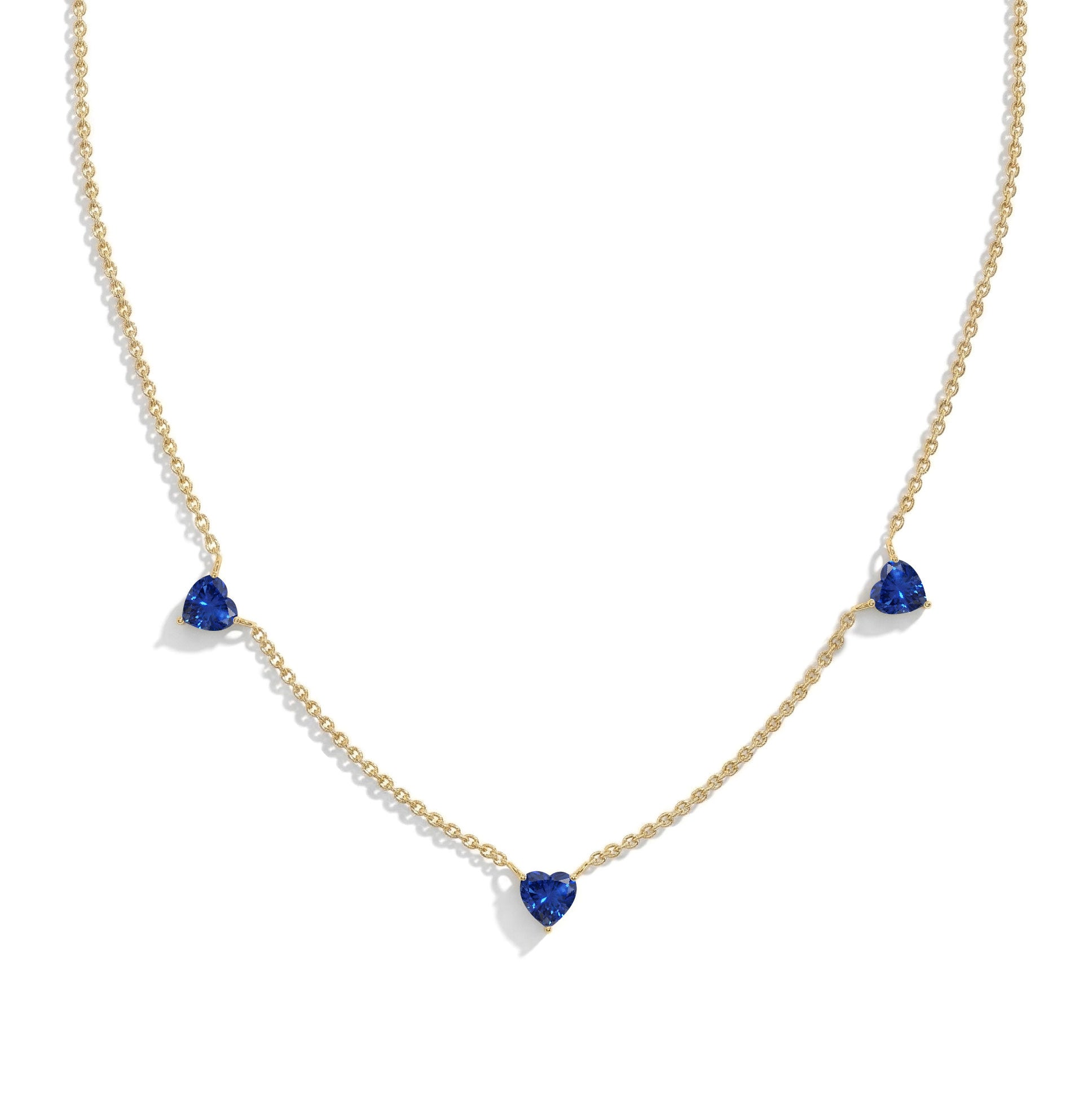 Fine jewelry Blue Sapphire necklace with three heart-shaped gemstones.
